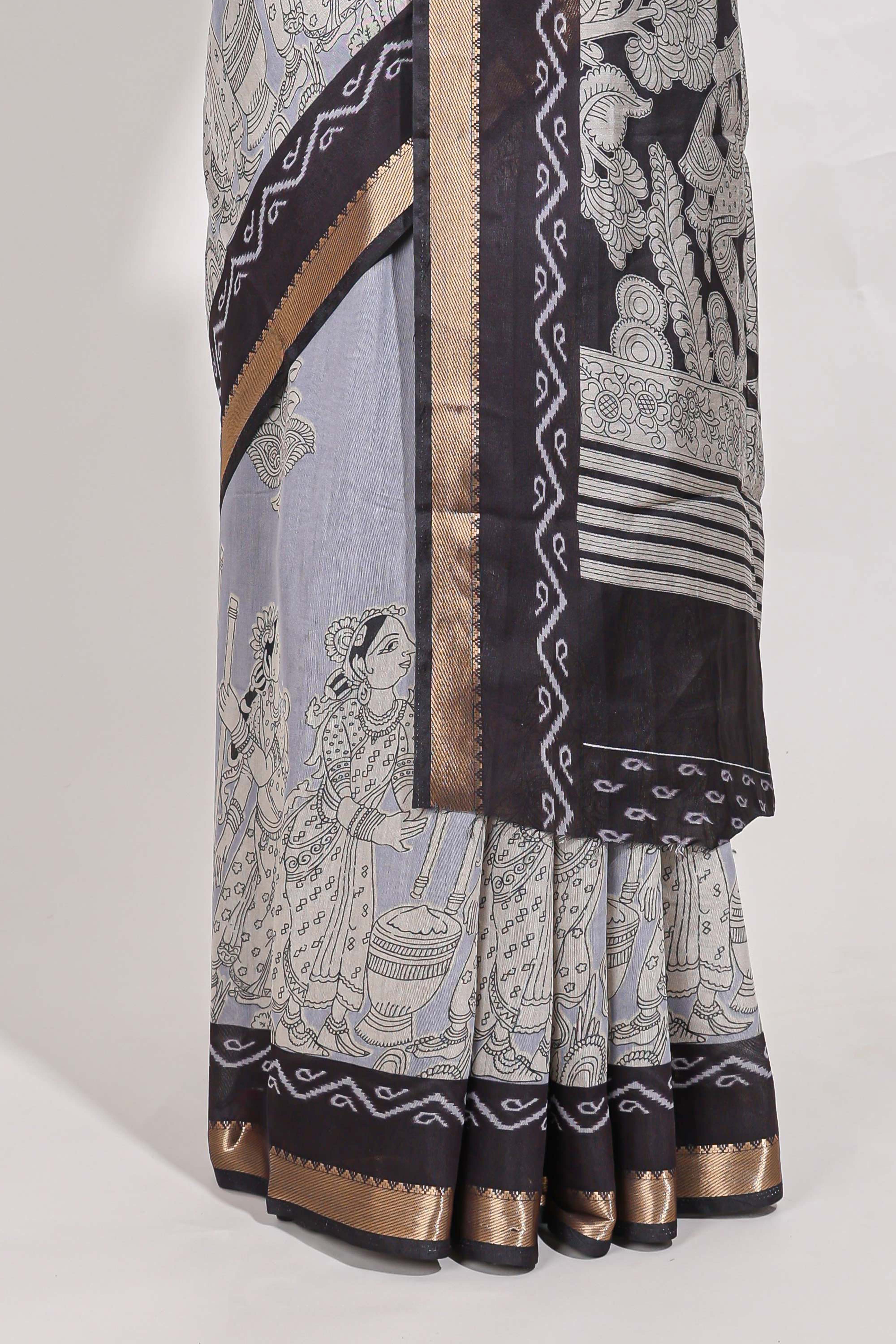 Indigo Blue colour viscose georgette saree All-over elegant ethnic detailing gold zari border and Statement pallu with artistic motifs with contrast printed blouse