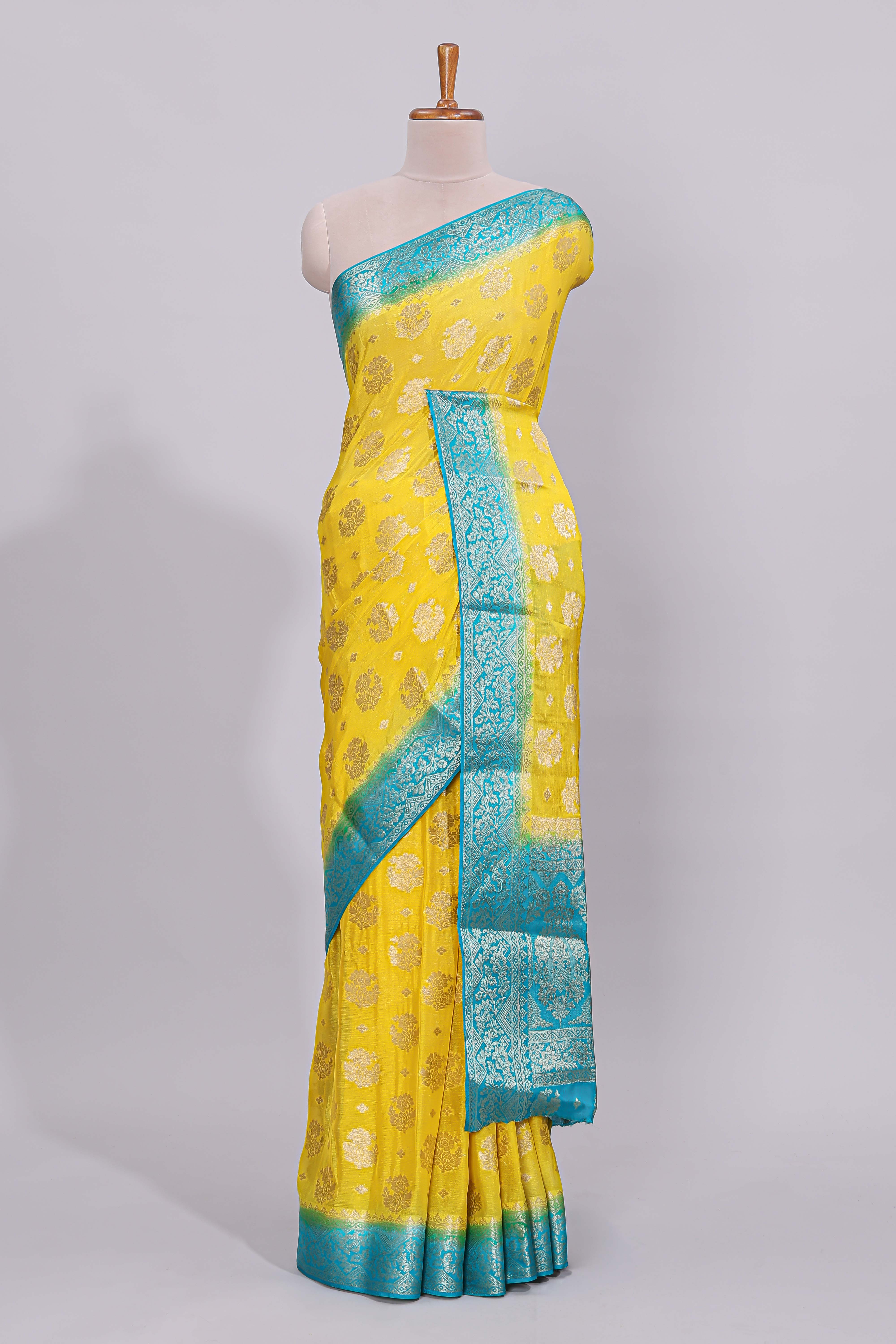 Yellow floral zari motifs viscose georgette saree with contrast zari border and blouse