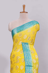 Yellow floral zari motifs viscose georgette saree with contrast zari border and blouse