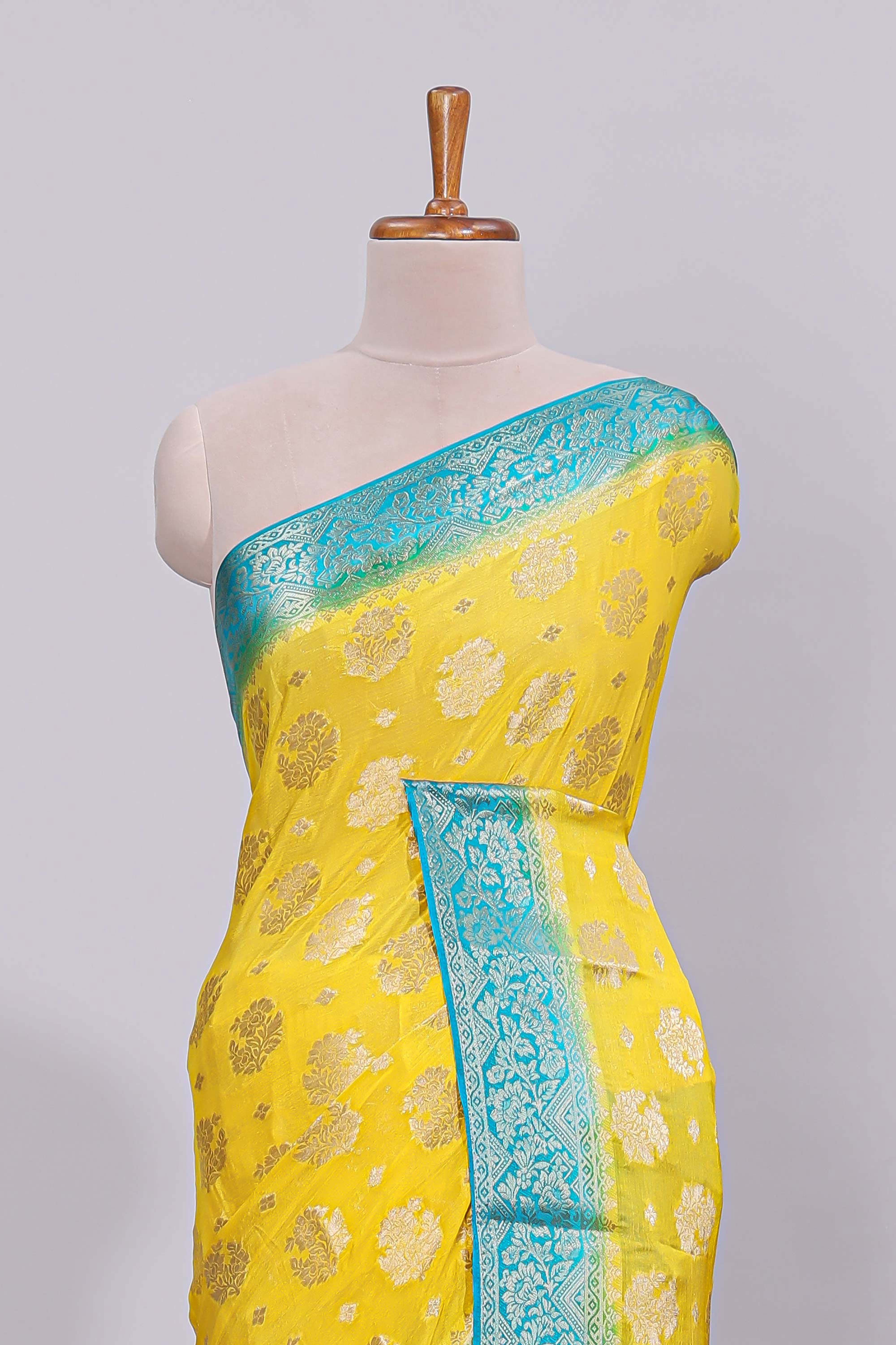 Yellow floral zari motifs viscose georgette saree with contrast zari border and blouse