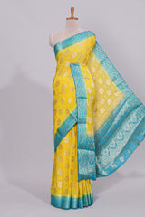 Yellow floral zari motifs viscose georgette saree with contrast zari border and blouse
