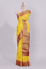 Yellow floral zari motifs viscose georgette saree with contrast checked zari border and blouse