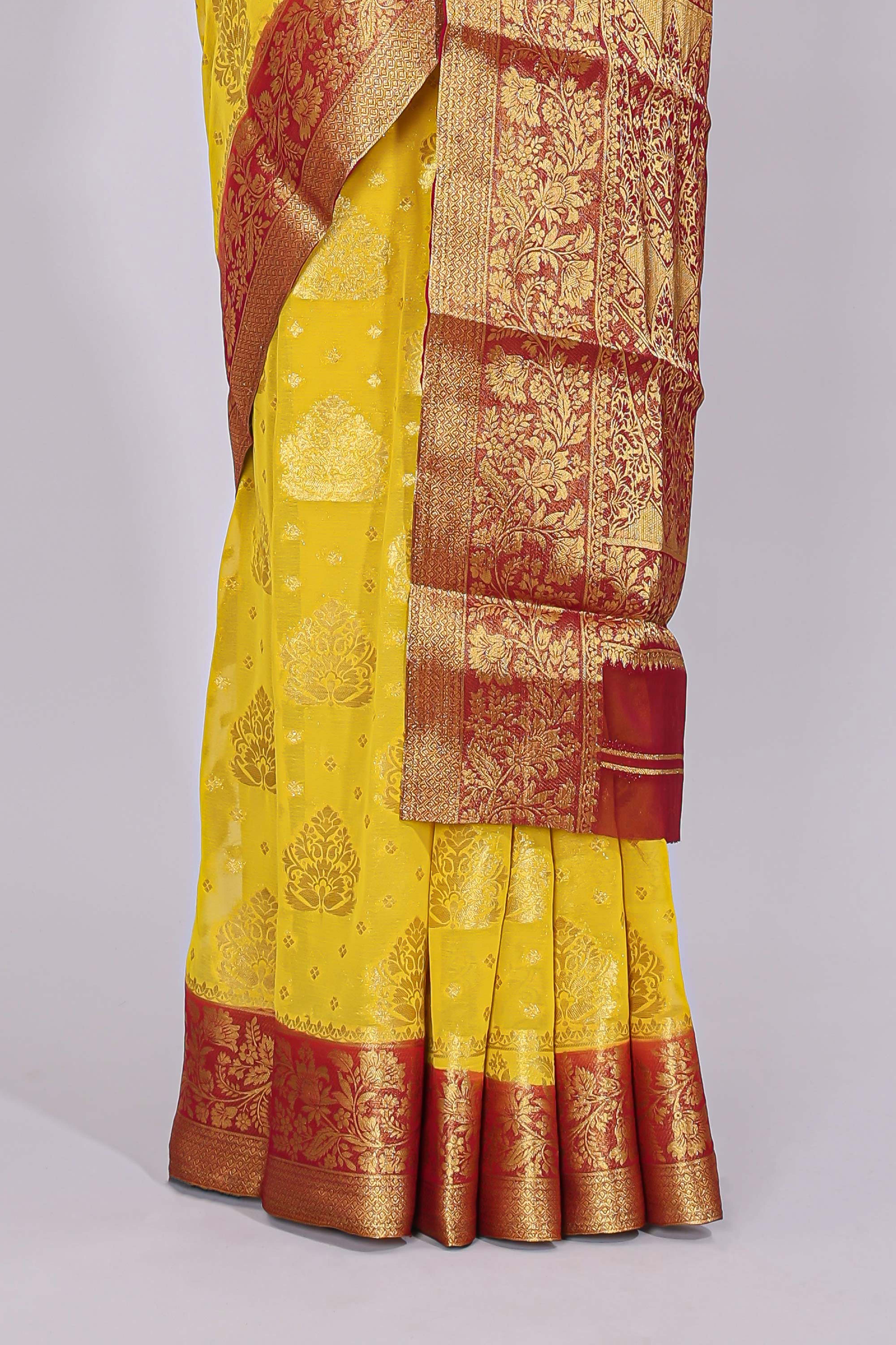 Yellow floral zari motifs viscose georgette saree with contrast checked zari border and blouse