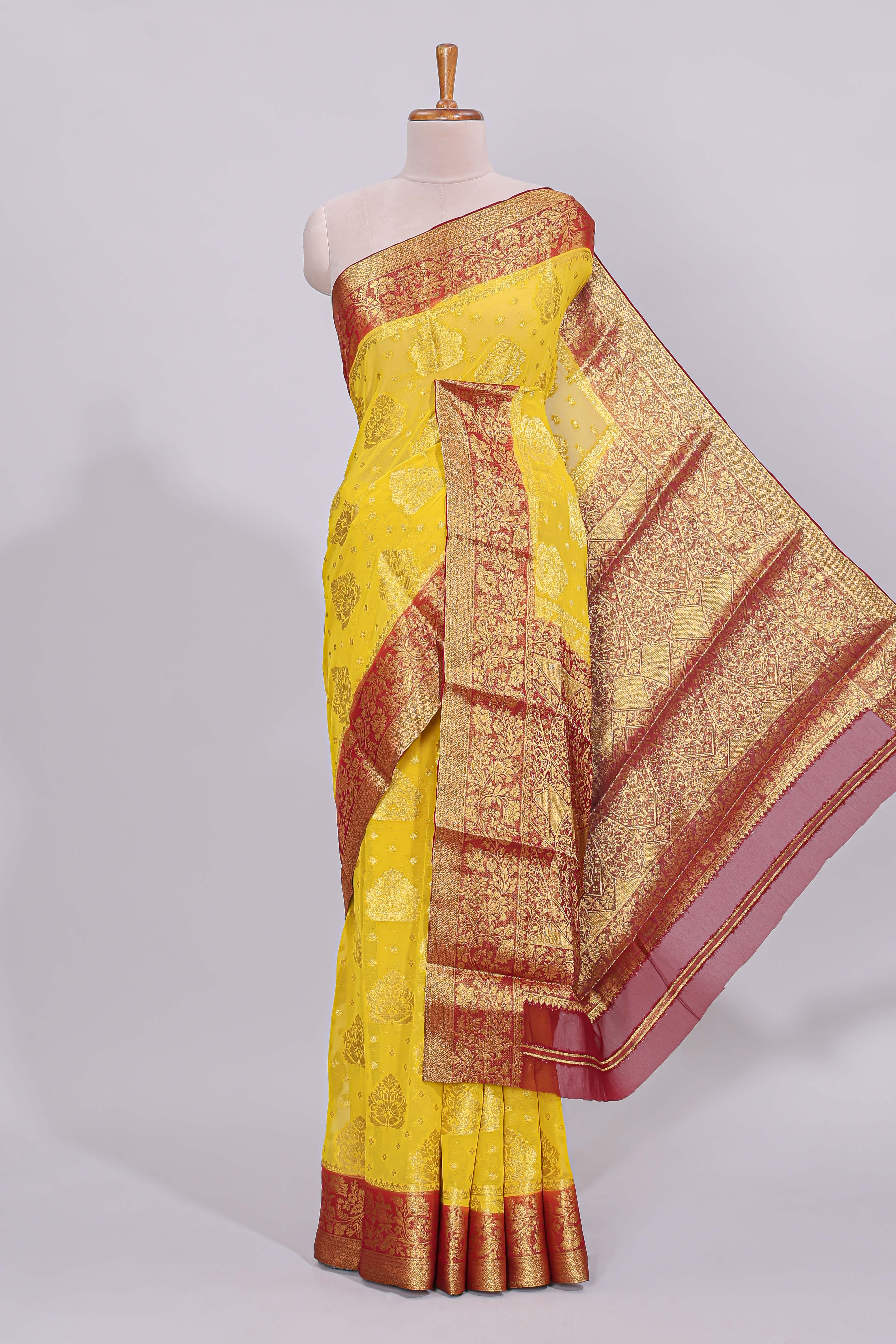 Yellow floral zari motifs viscose georgette saree with contrast checked zari border and blouse