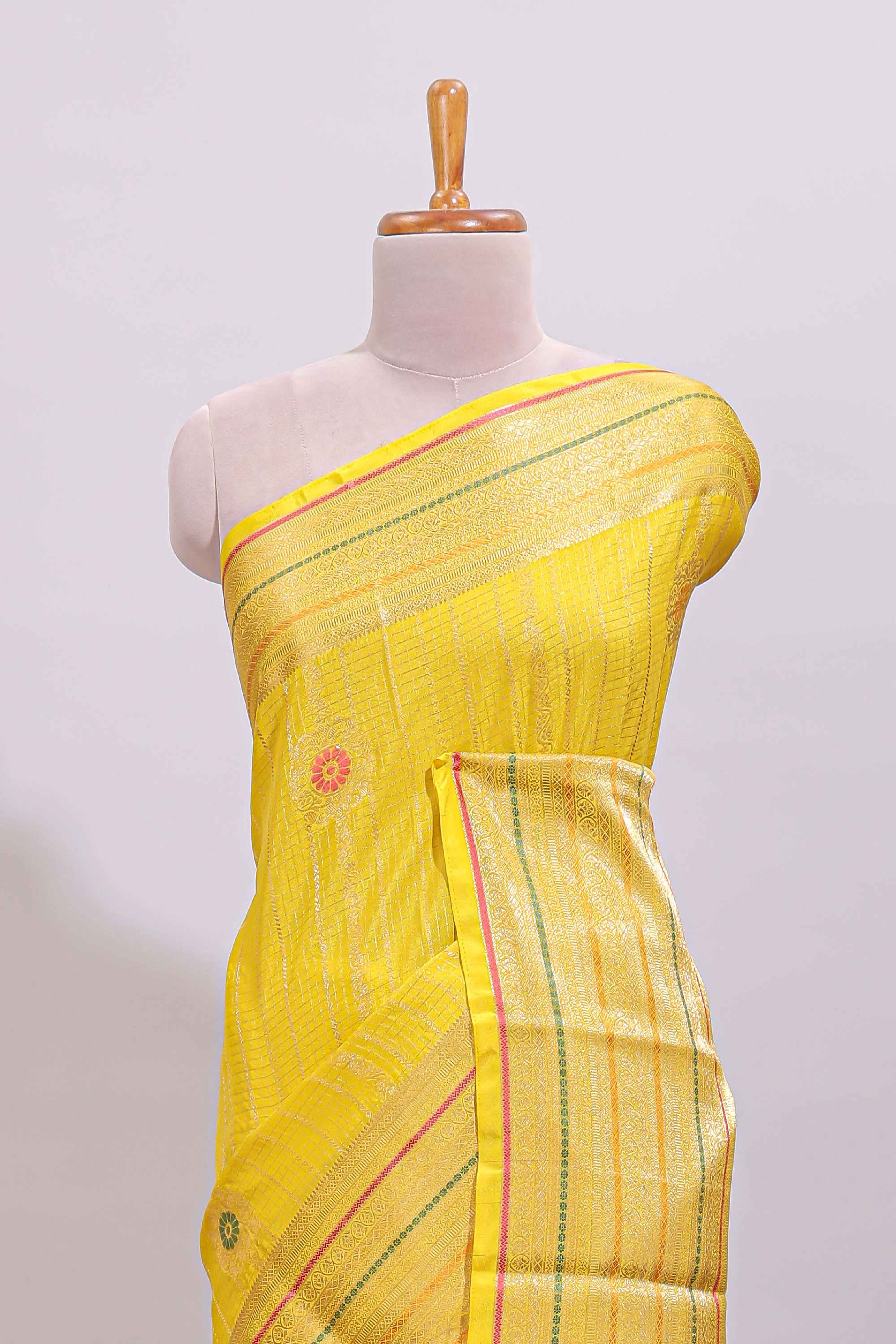 Bright yellow diagonal and vertical striped weave design viscose georgette saree with self zari border and blouse