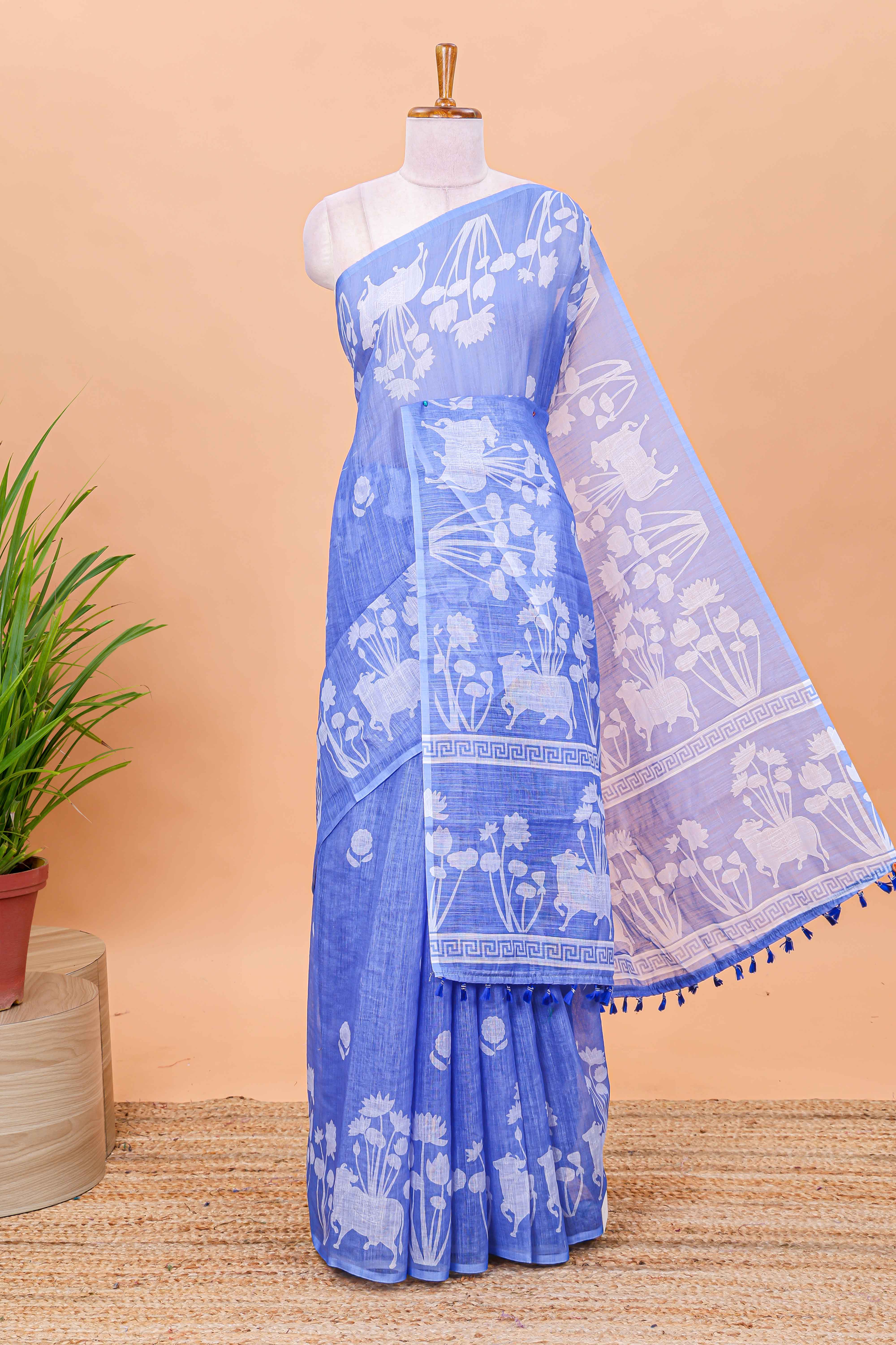 Blue linen cotton saree with floral motifs