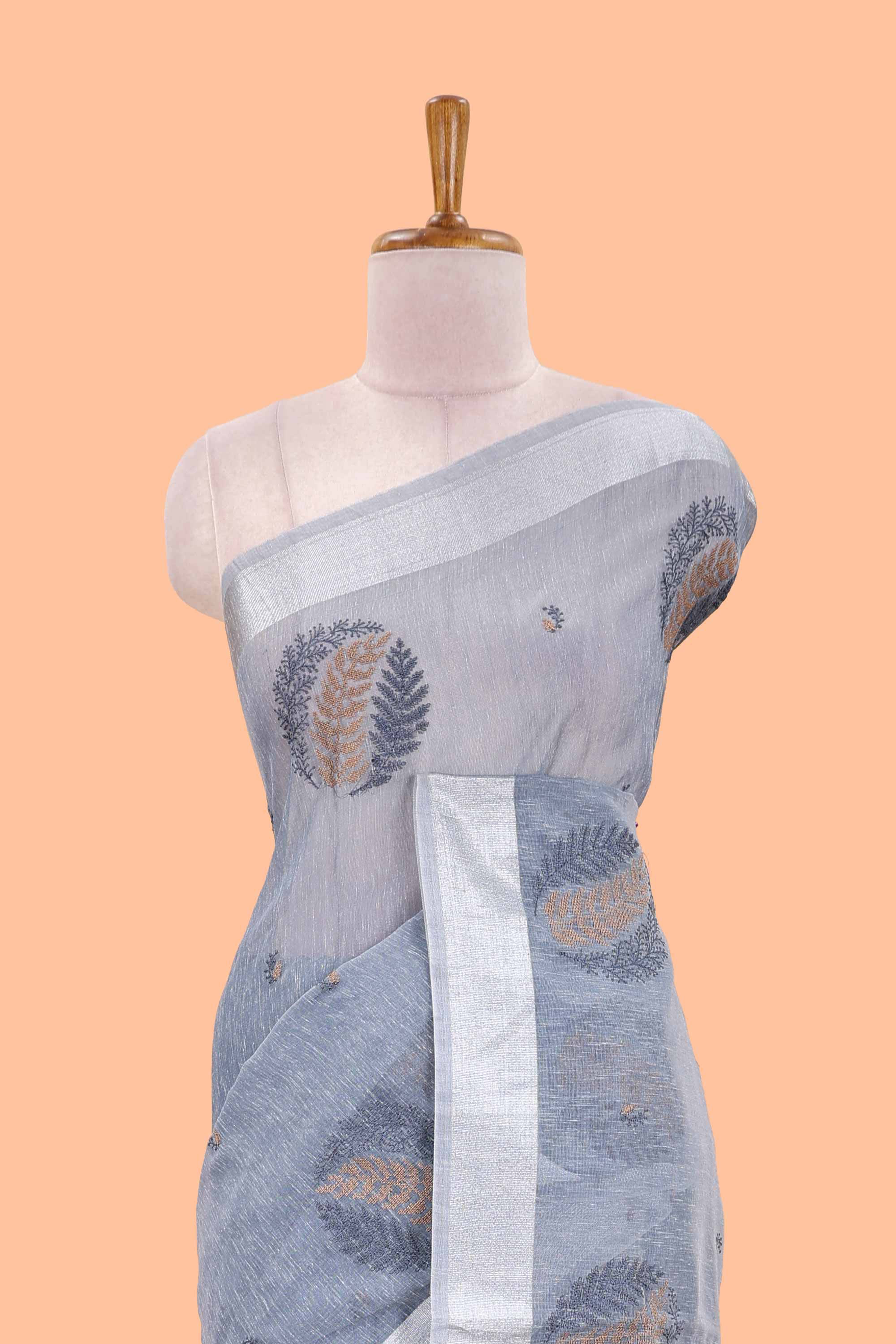 Blue jute cotton saree leaf motifs with zari border and pallu