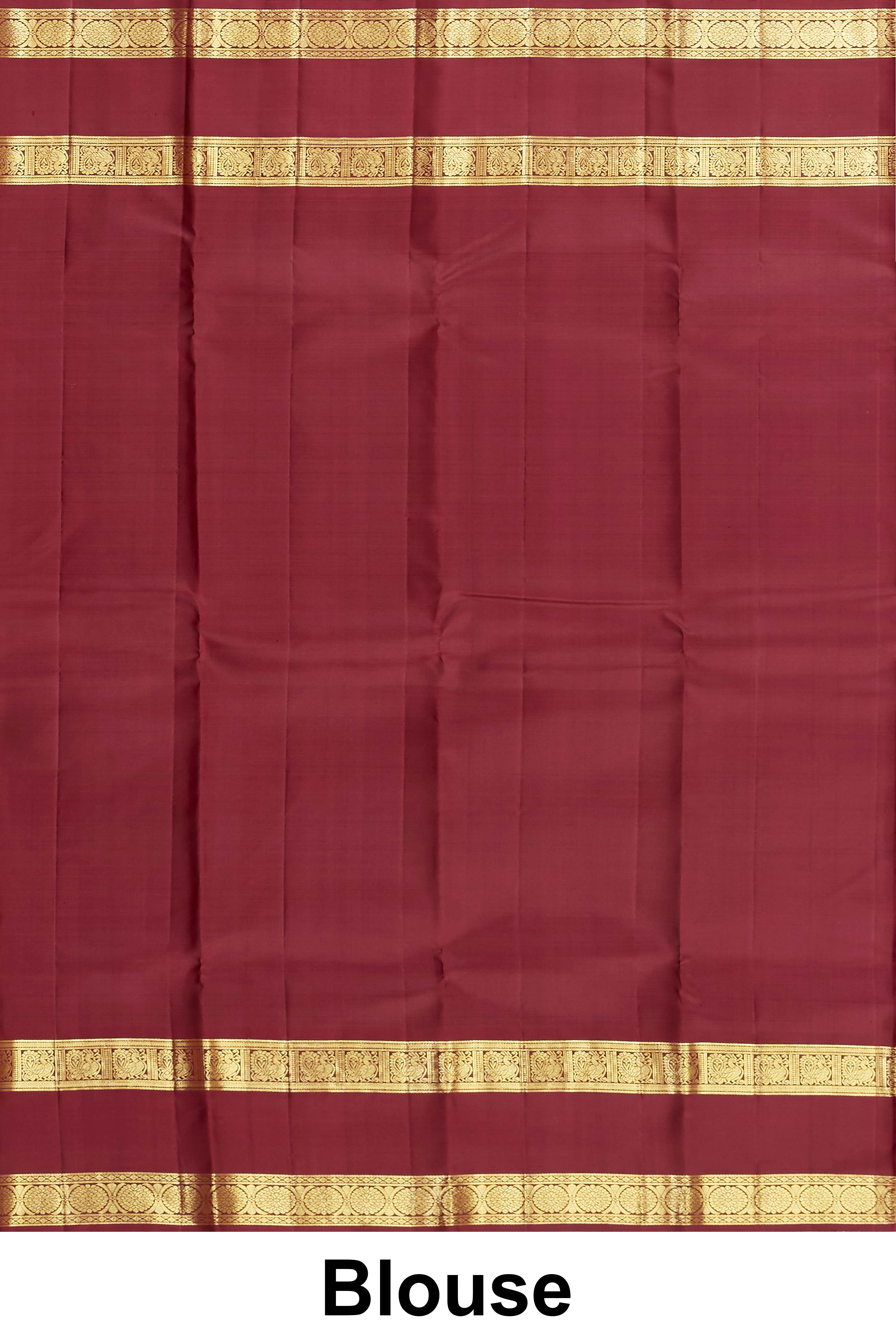 Elegant rust orange Kanchipuram saree