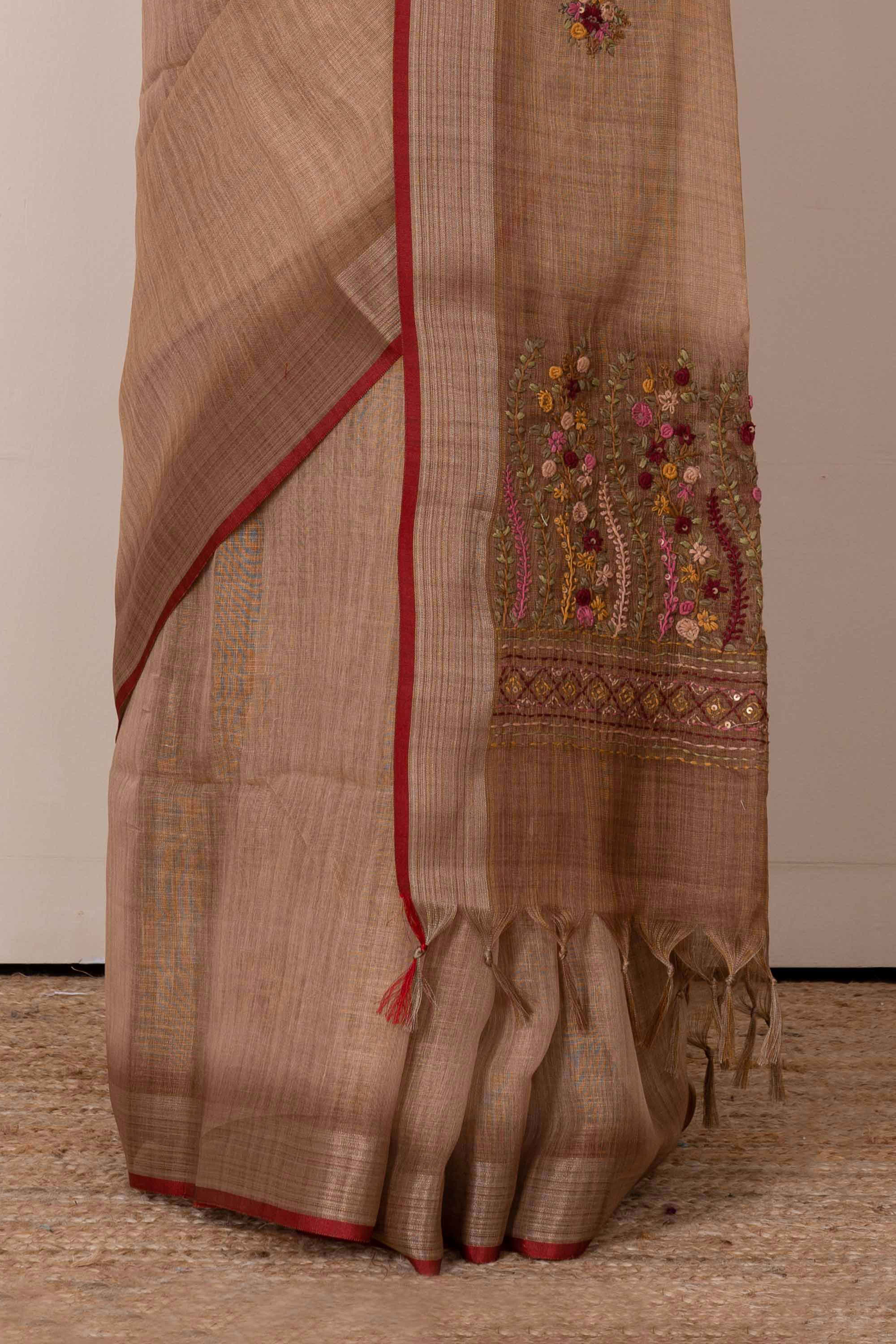 Orange linen saree with French knot work