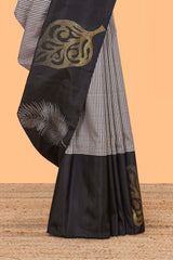 Multi color checked parambariya pattu saree with contrast leaf zari border and golden zari pallu