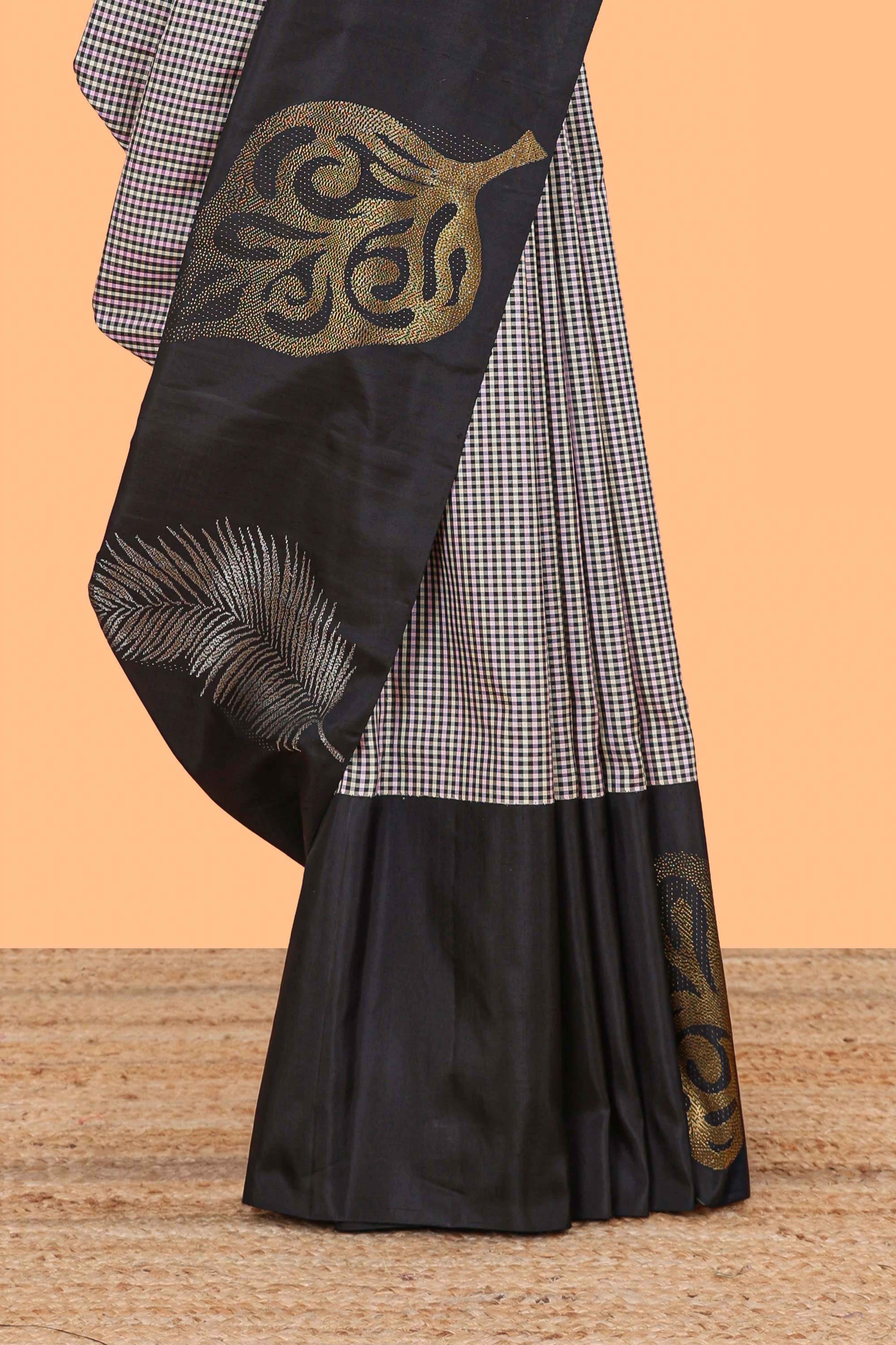 Multi color checked parambariya pattu saree with contrast leaf zari border and golden zari pallu