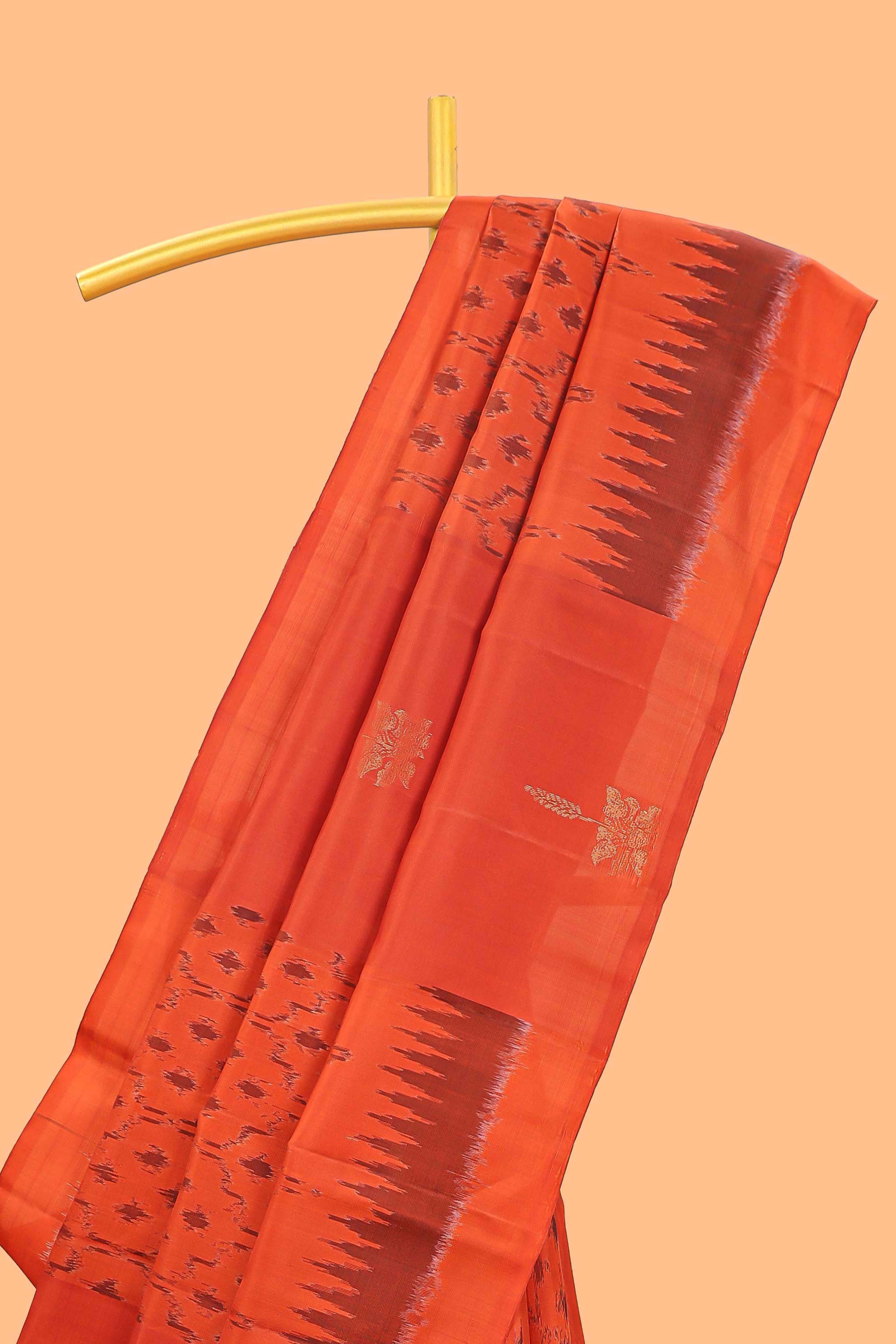 Orange ikkat style parambariya pattu saree with self border and contrast pallu