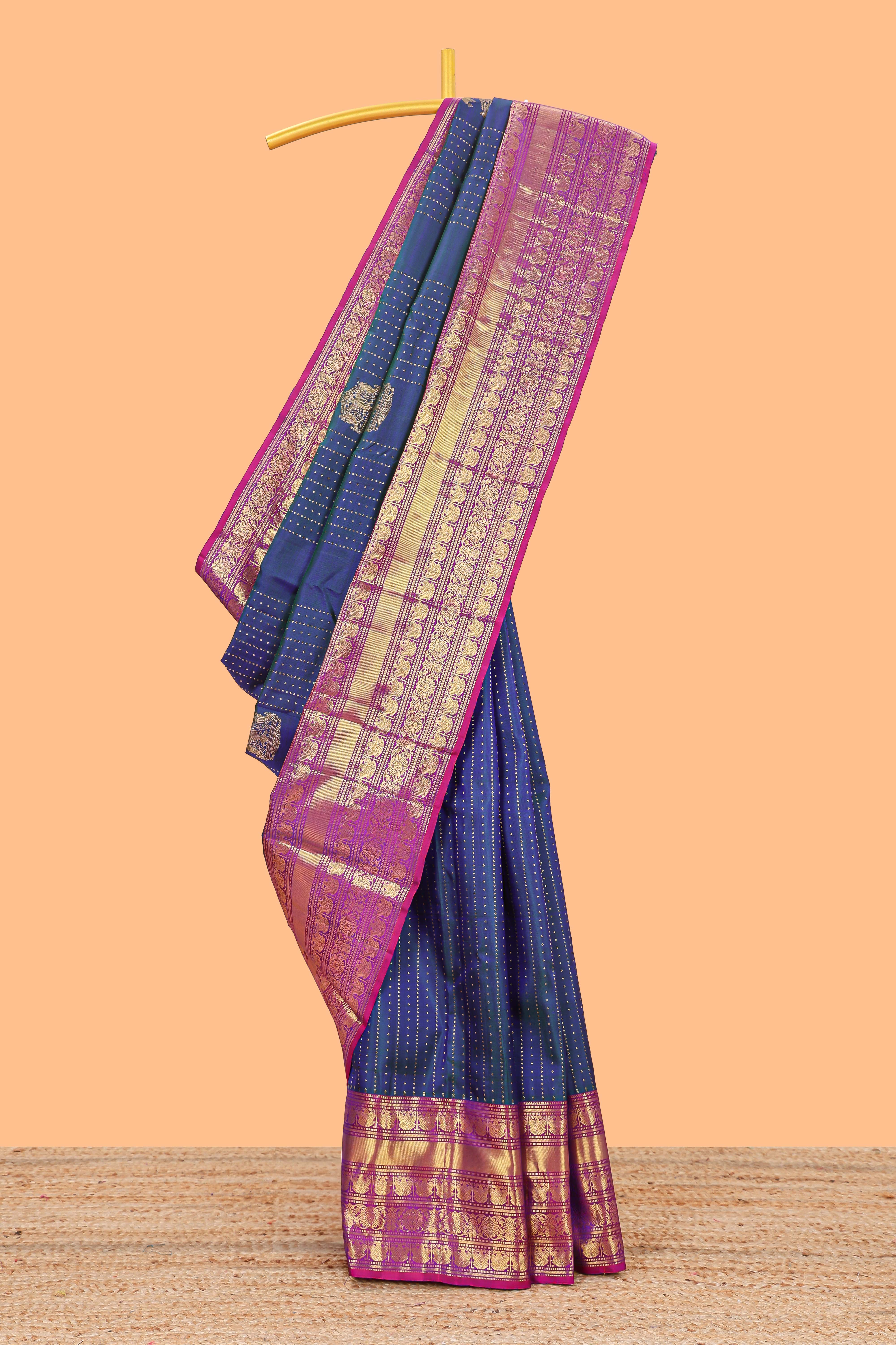 Blue zari butta dotted stripes parambariya pattu saree with contrast border and pallu
