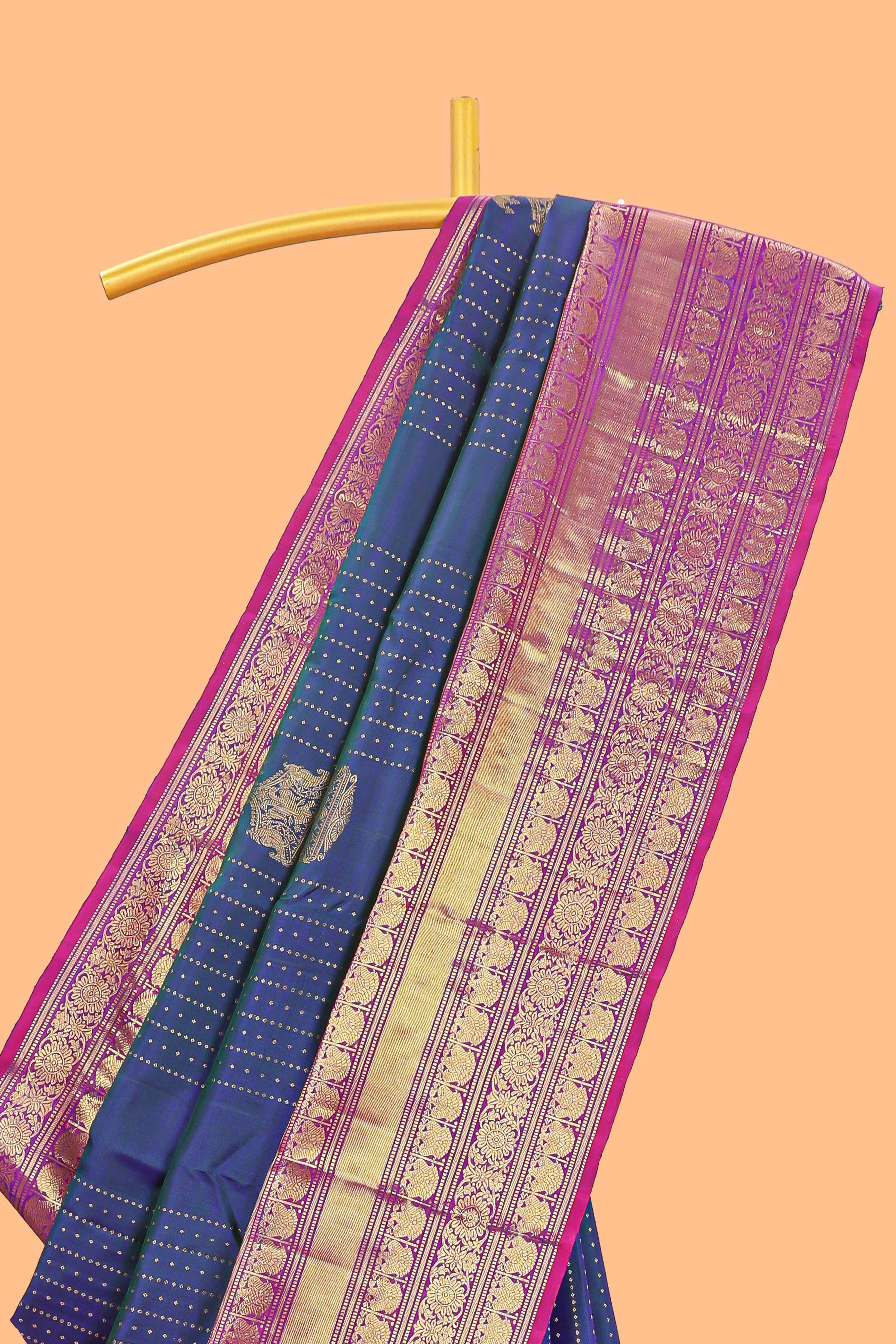 Blue zari butta dotted stripes parambariya pattu saree with contrast border and pallu