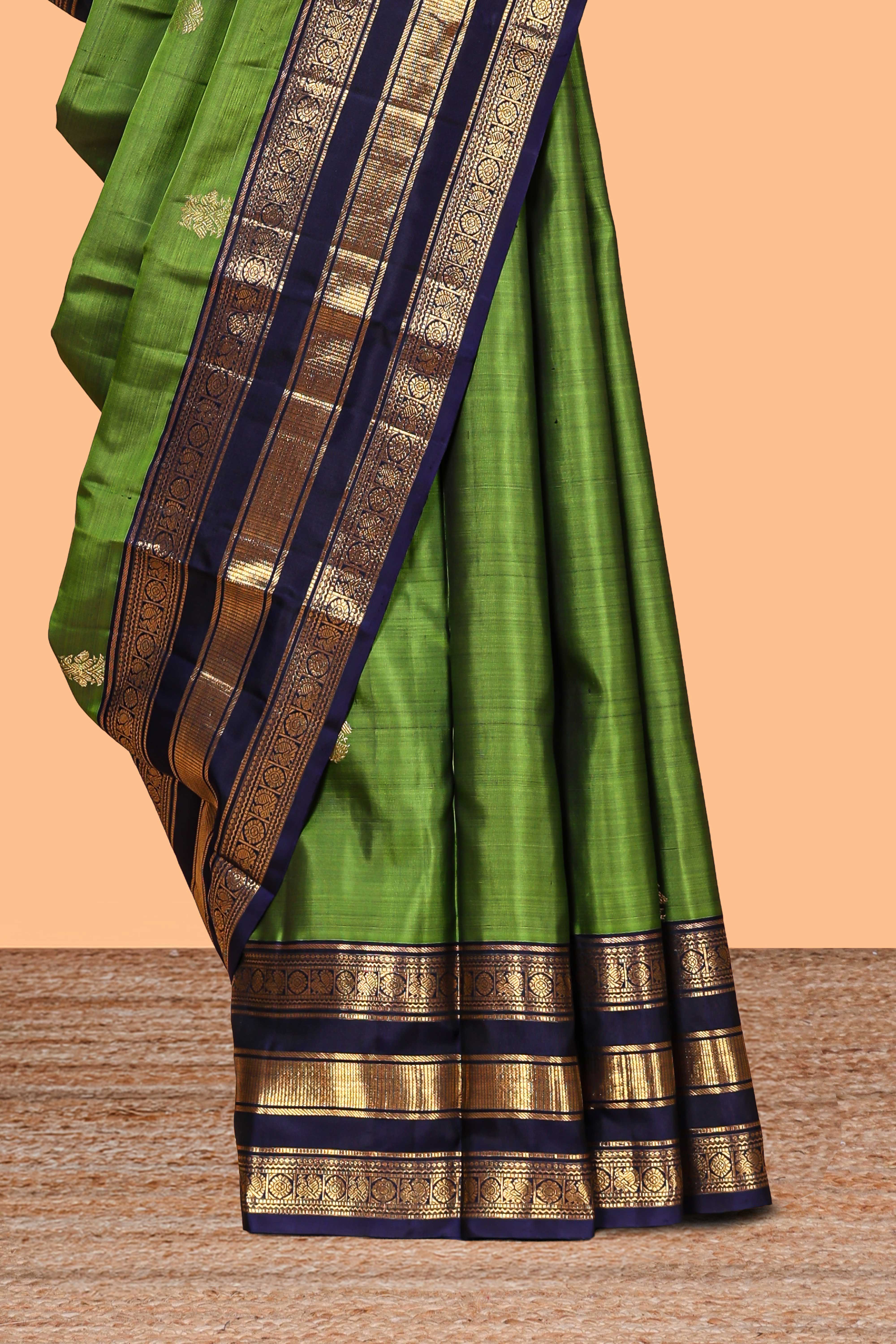 Green zari motifs parambariya pattu saree with contrast zari border and blouse