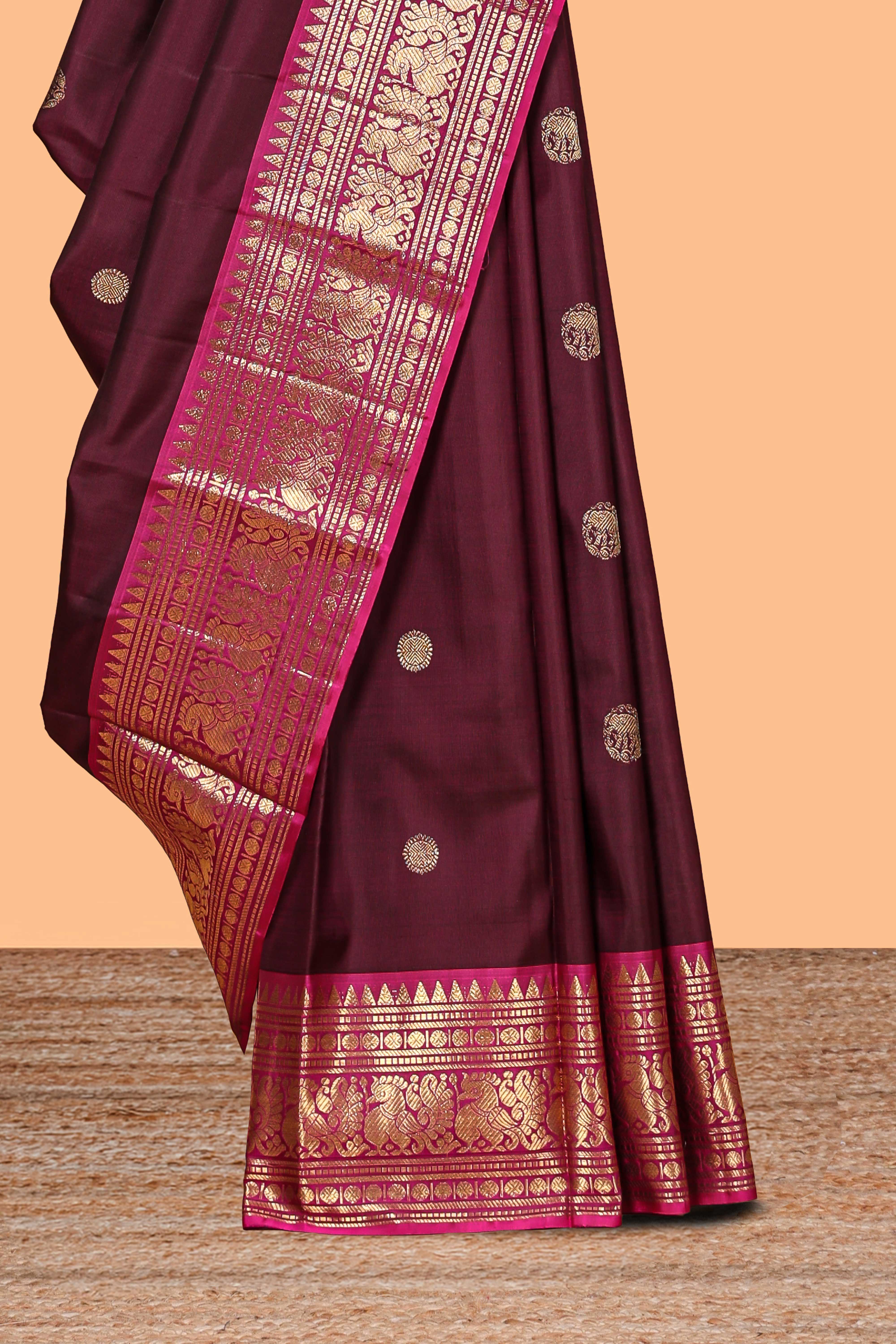 Maroon zari motifs parambariya pattu saree with contrast zari border and blouse
