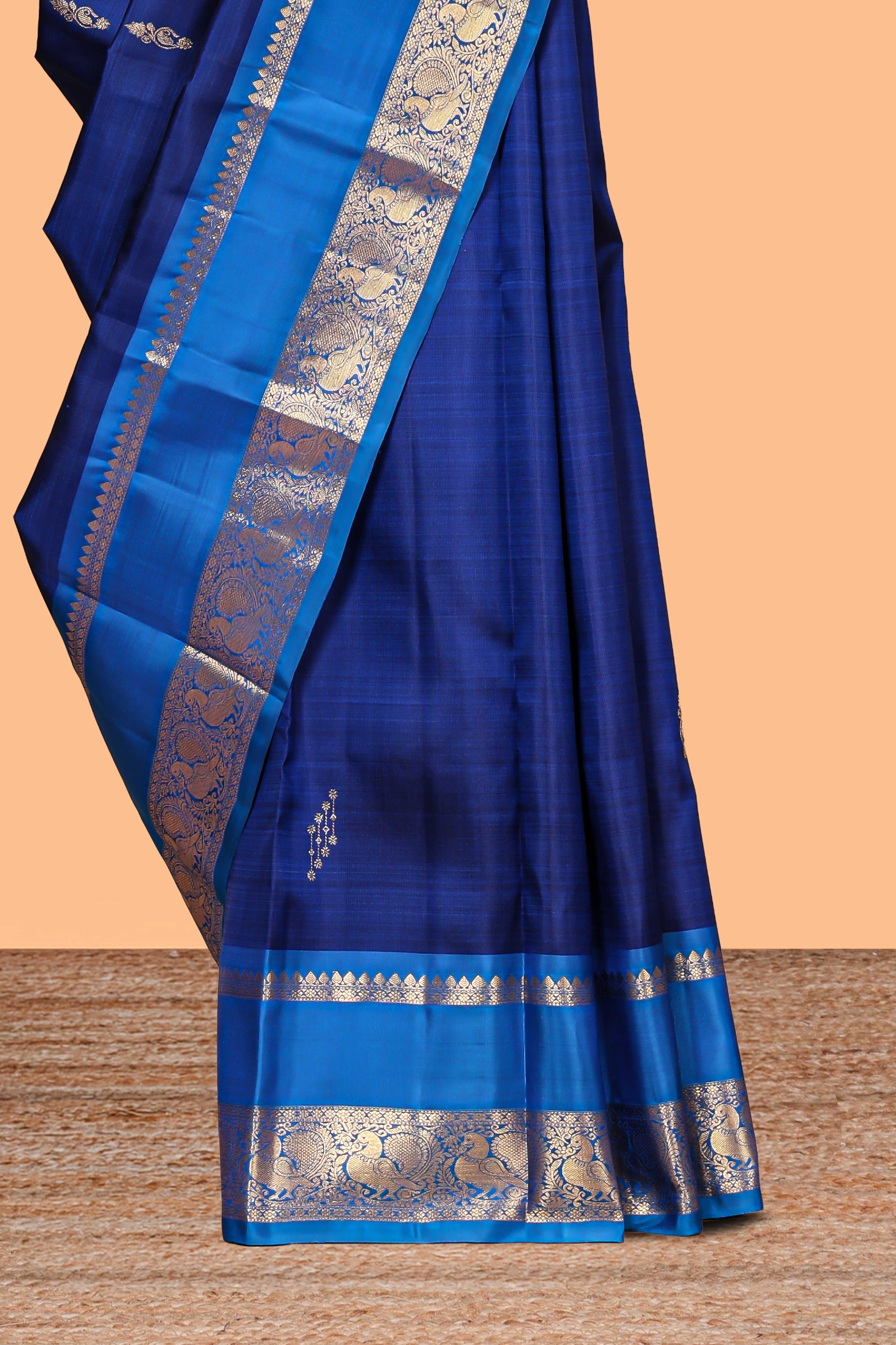 Blue zari motifs parambariya pattu saree with contrast zari border and blouse