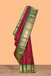 Maroon zari motifs parambariya pattu saree with contrast zari border and blouse