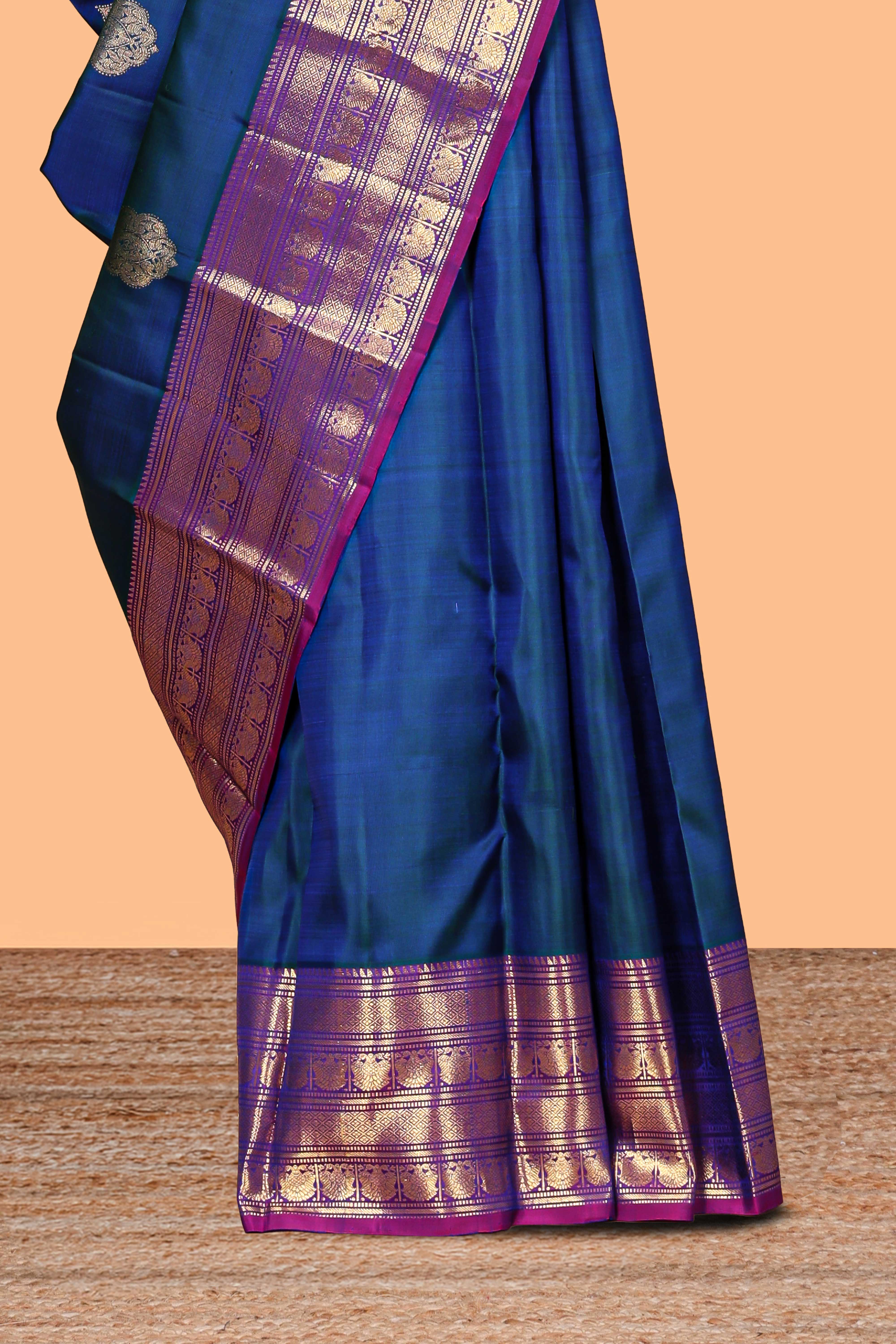 Blue zari motifs parambariya pattu saree with contrast zari border and blouse