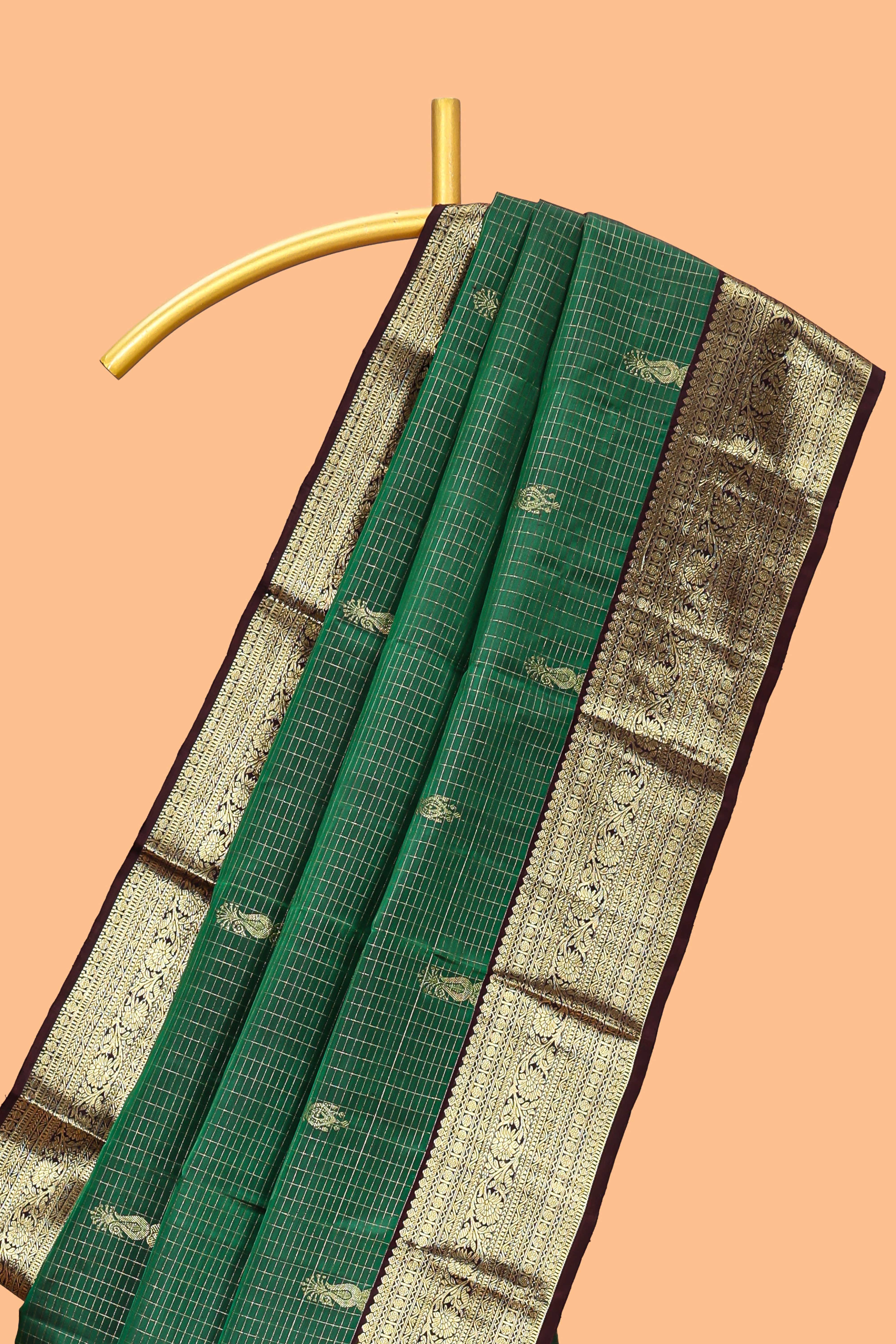 Green checked floral design zari motifs parambariya pattu saree with contrast zari border and contrast blouse