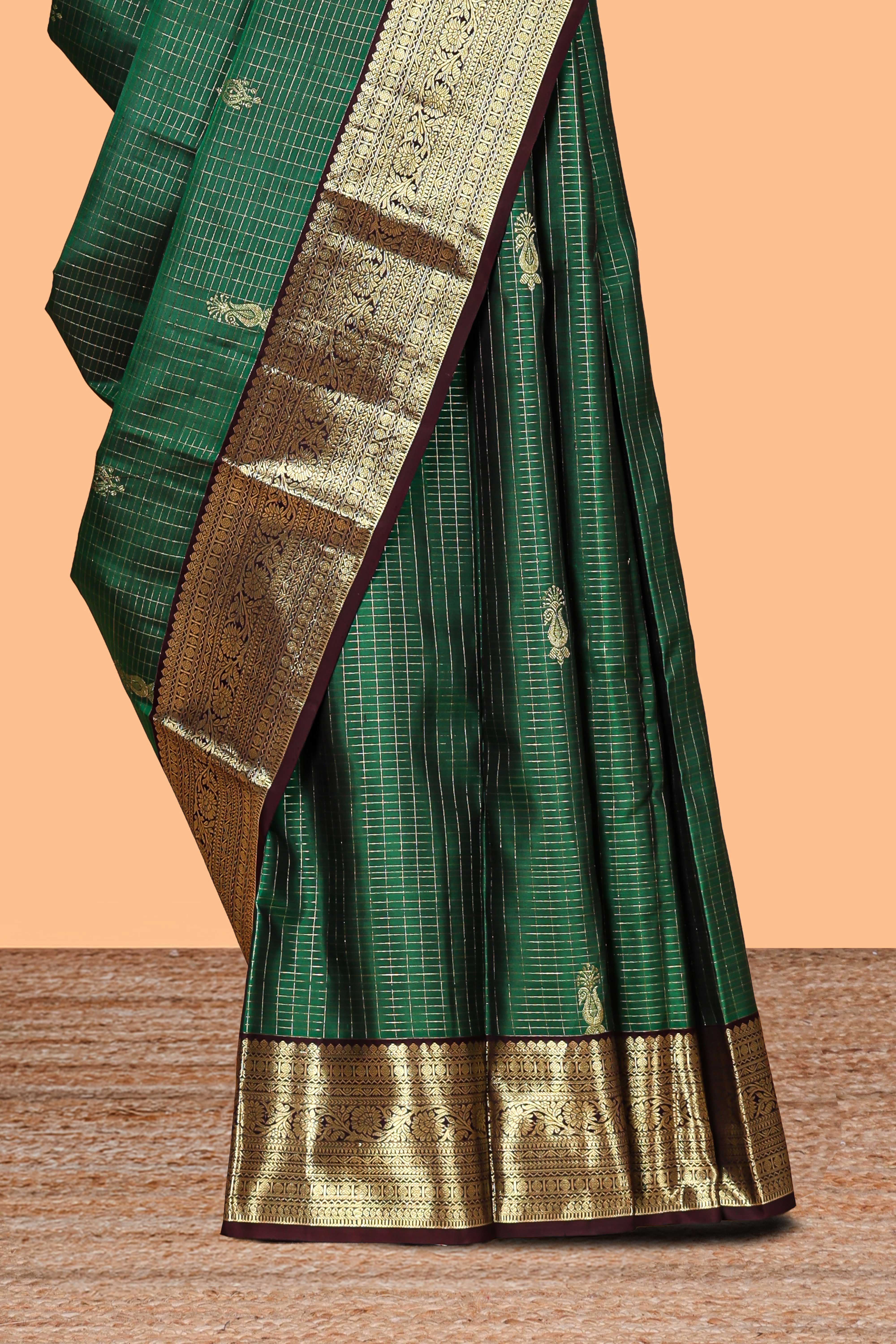 Green checked floral design zari motifs parambariya pattu saree with contrast zari border and contrast blouse