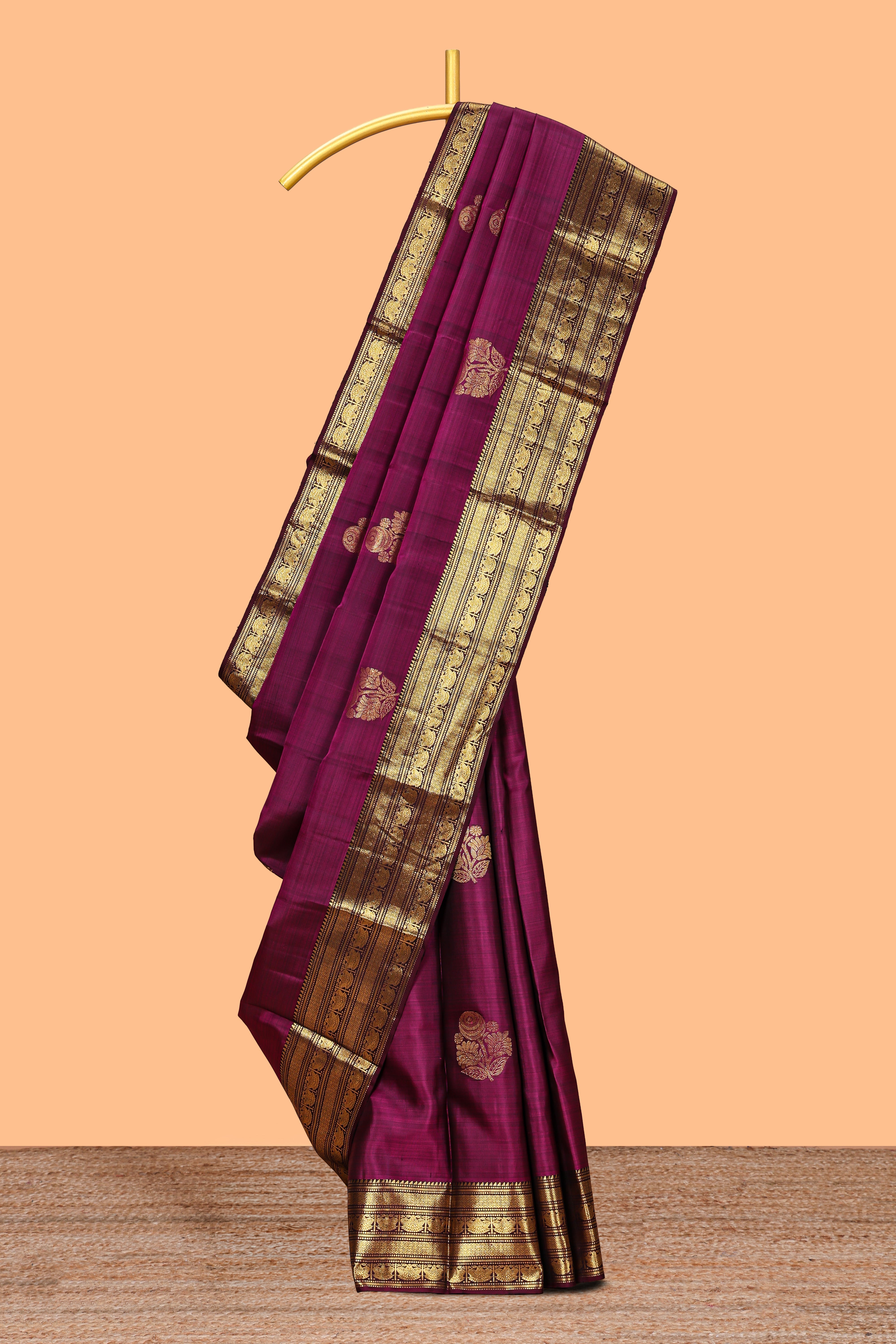 Magenta floral design zari motifs parambariya pattu saree with self zari border and matching blouse