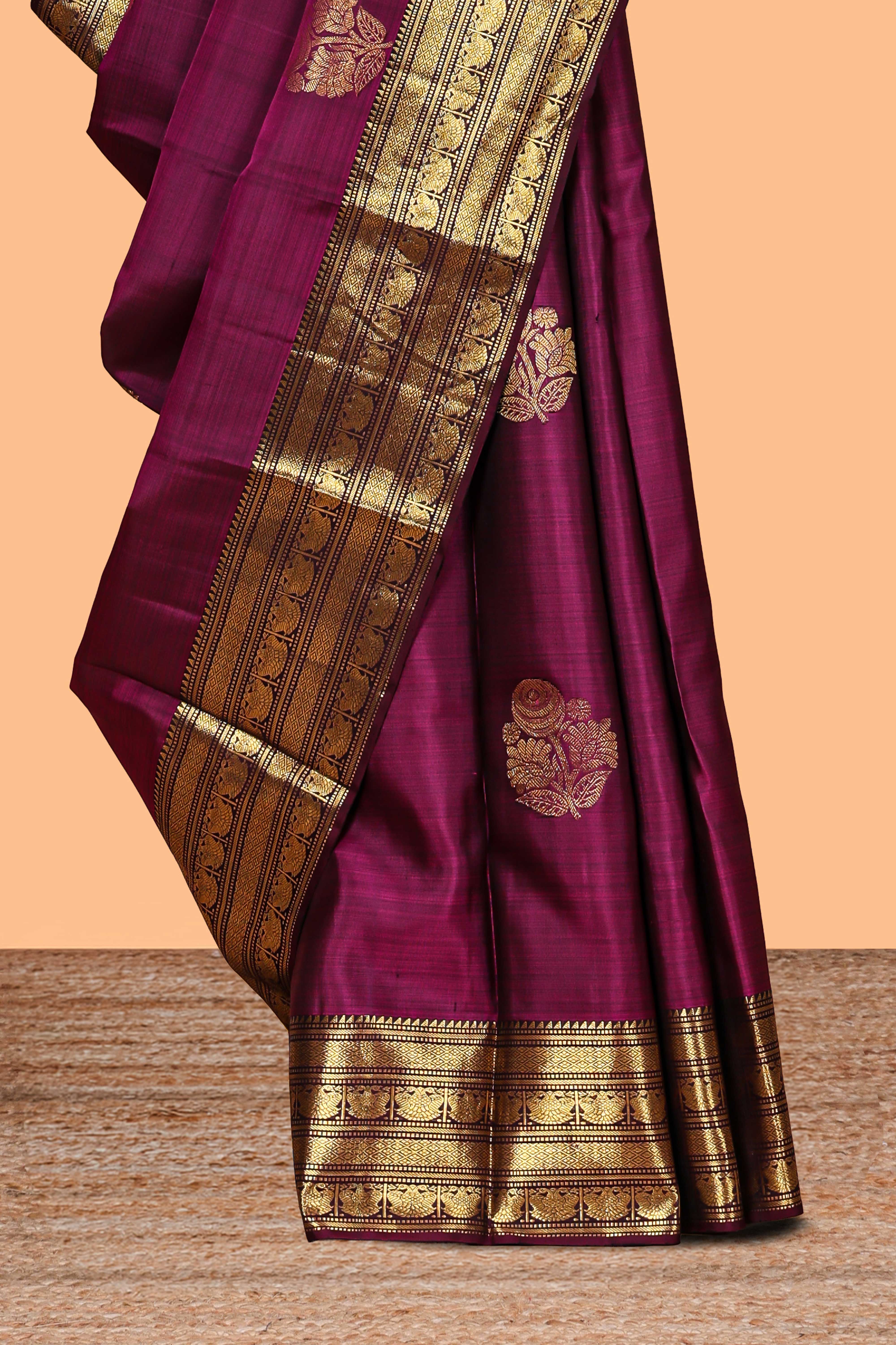 Magenta floral design zari motifs parambariya pattu saree with self zari border and matching blouse