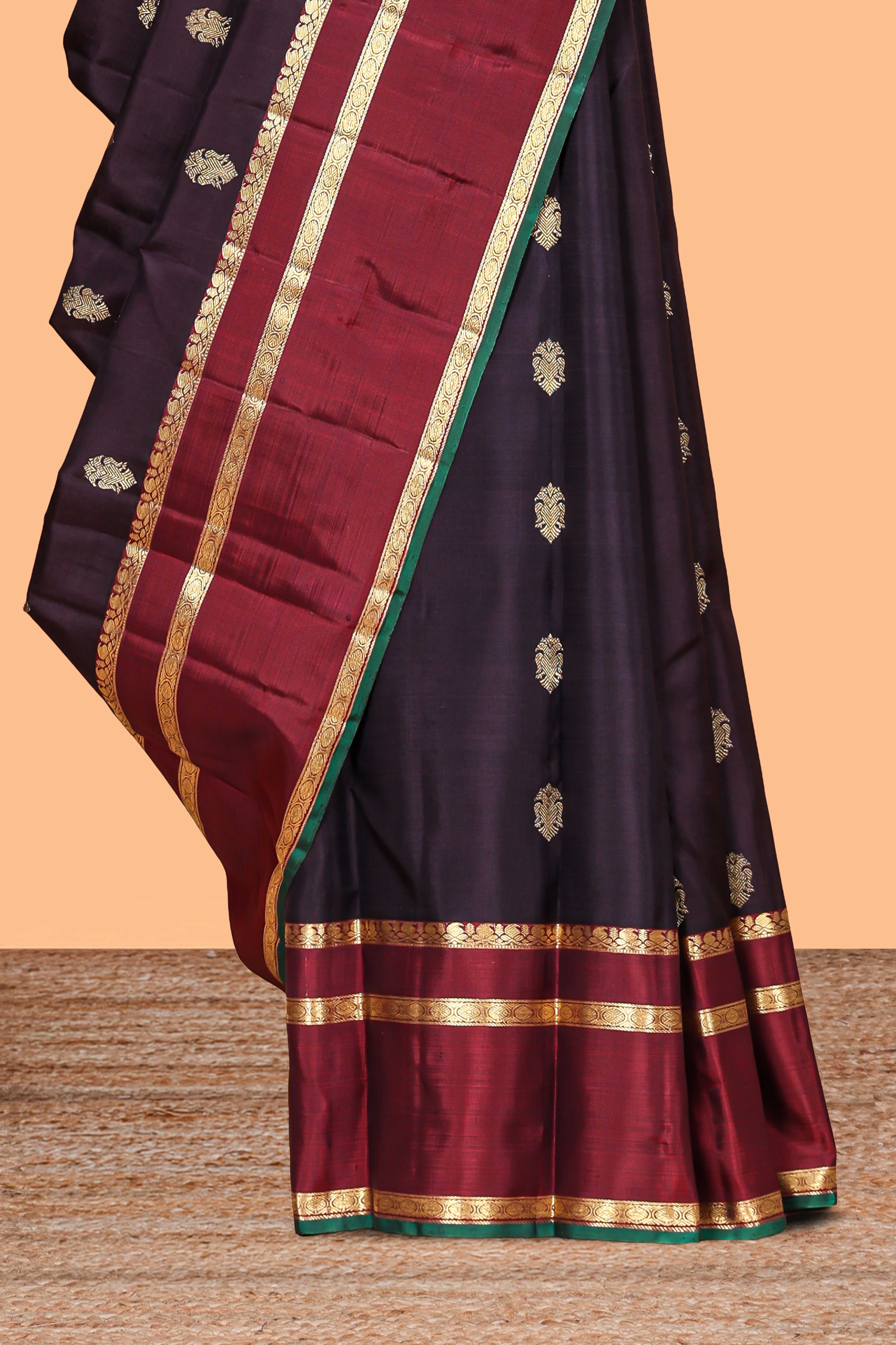 Dark purple zari motifs parambariya pattu saree with contrast zari border and blouse