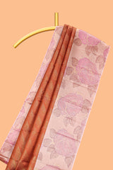 Rust orange geometric design parambariya pattu saree with contrast floral border and motifs blouse