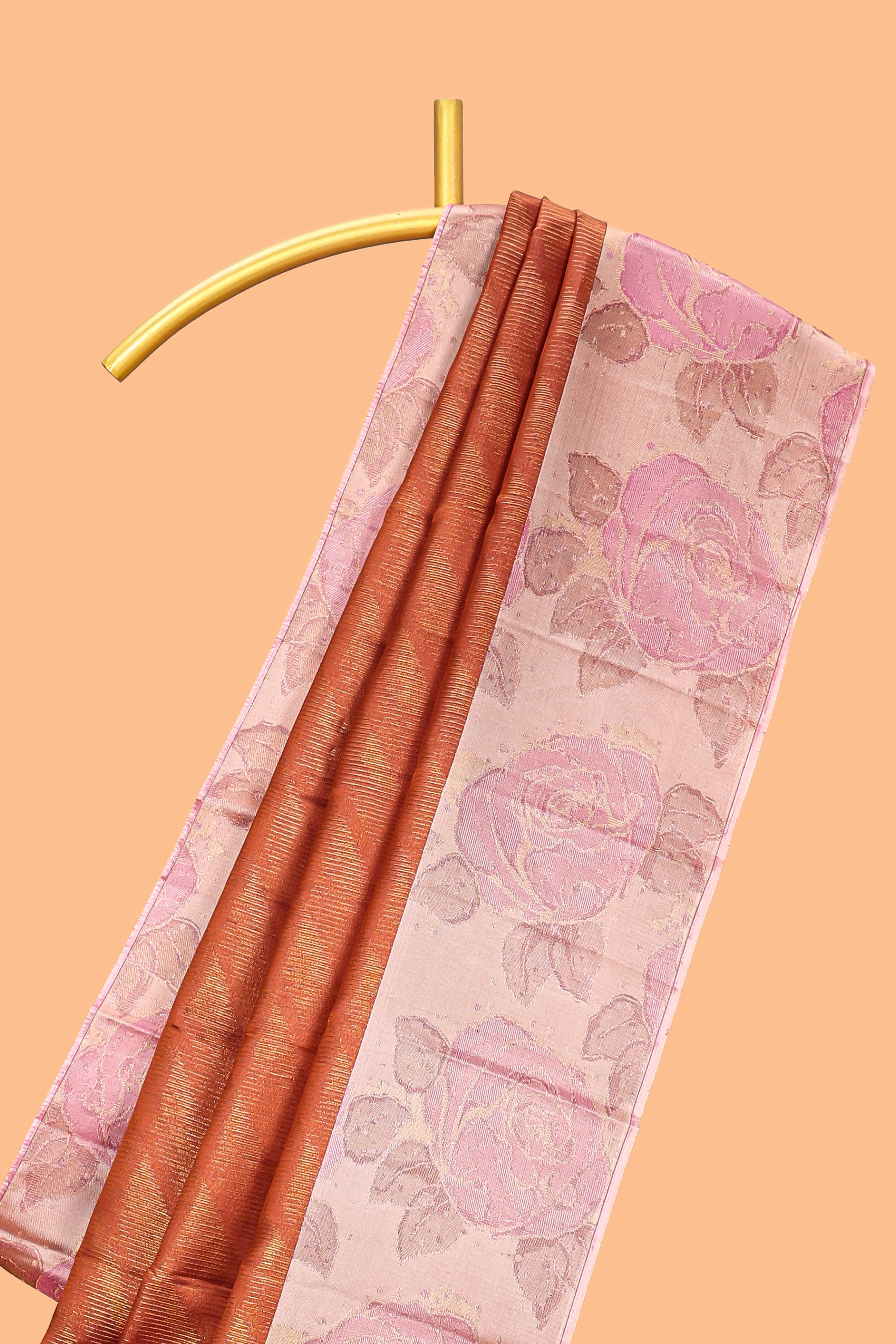 Rust orange geometric design parambariya pattu saree with contrast floral border and motifs blouse