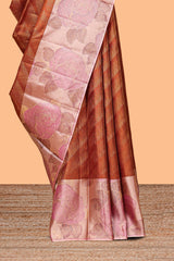 Rust orange geometric design parambariya pattu saree with contrast floral border and motifs blouse