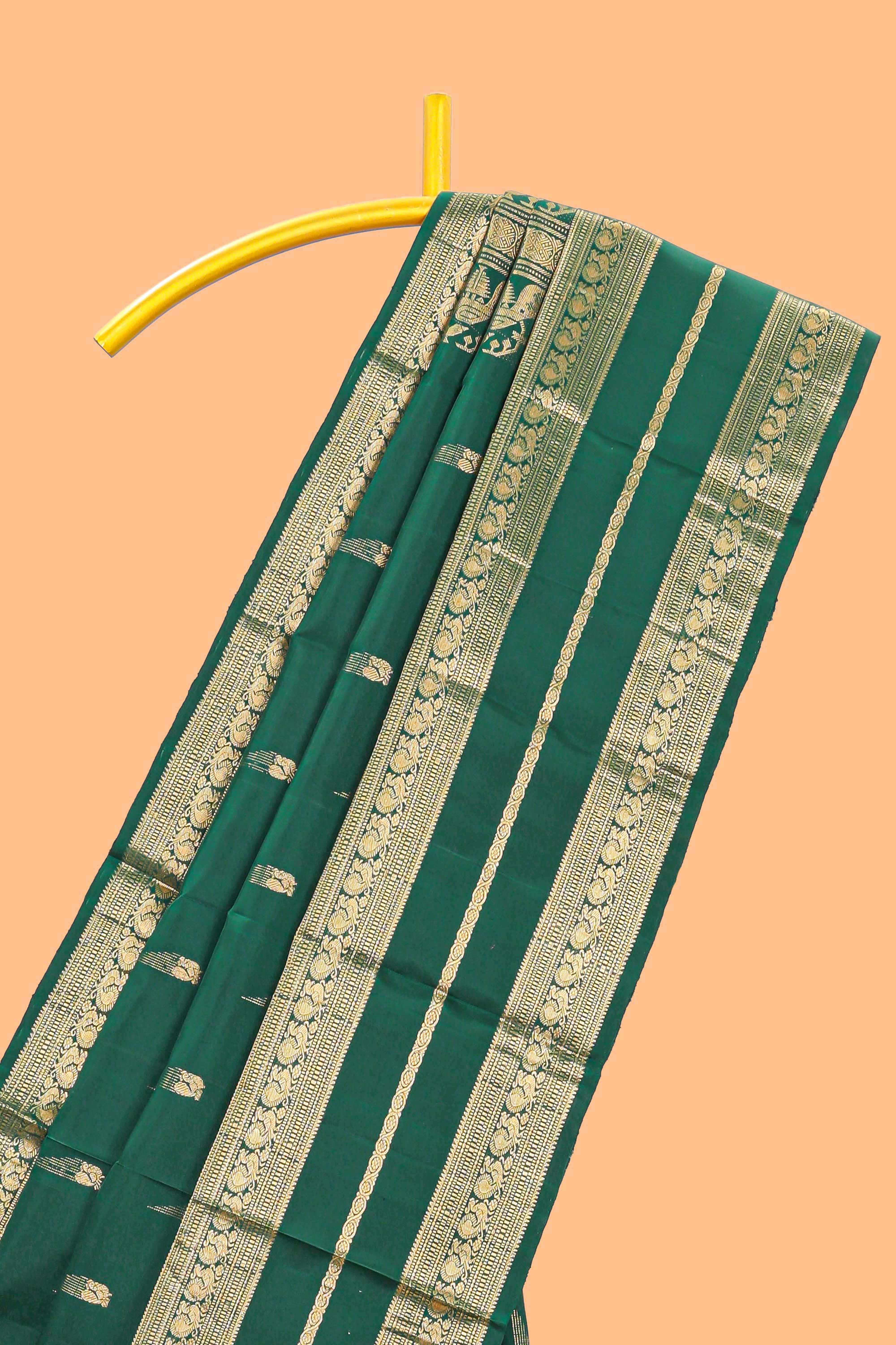 Dark green gold zari butta motifs parambariya pattu saree with self zari border and matching blouse