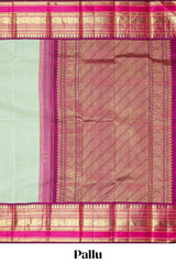 Mint green gold zari butta designed parambariya pattu saree with contrast golden zari border and contrasting pallu beautiful zari design