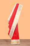 Bright red peacock motifs checked parambariya pattu saree with contrast golden zari border and contrasting pallu designed with geometric patterns and peacock motifs