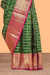 Green Checked butta designed parambariya pattu saree with contrast elephant motif zari border and geometric zari pallu
