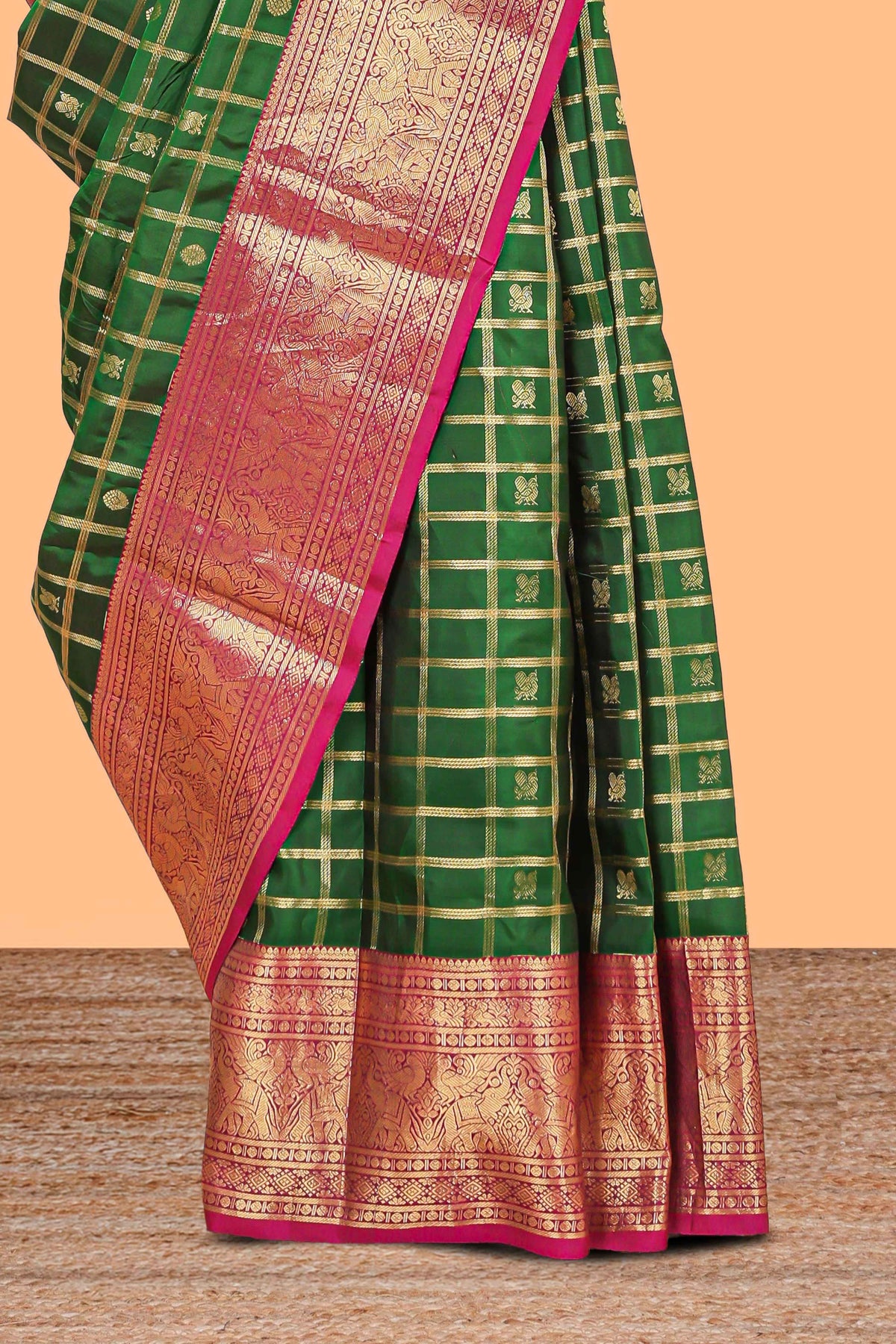 Green Checked butta designed parambariya pattu saree with contrast elephant motif zari border and geometric zari pallu