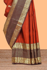 Rust orange butta designed parambariya pattu saree with contrast retta patta zari border and geometric zari designed pallu