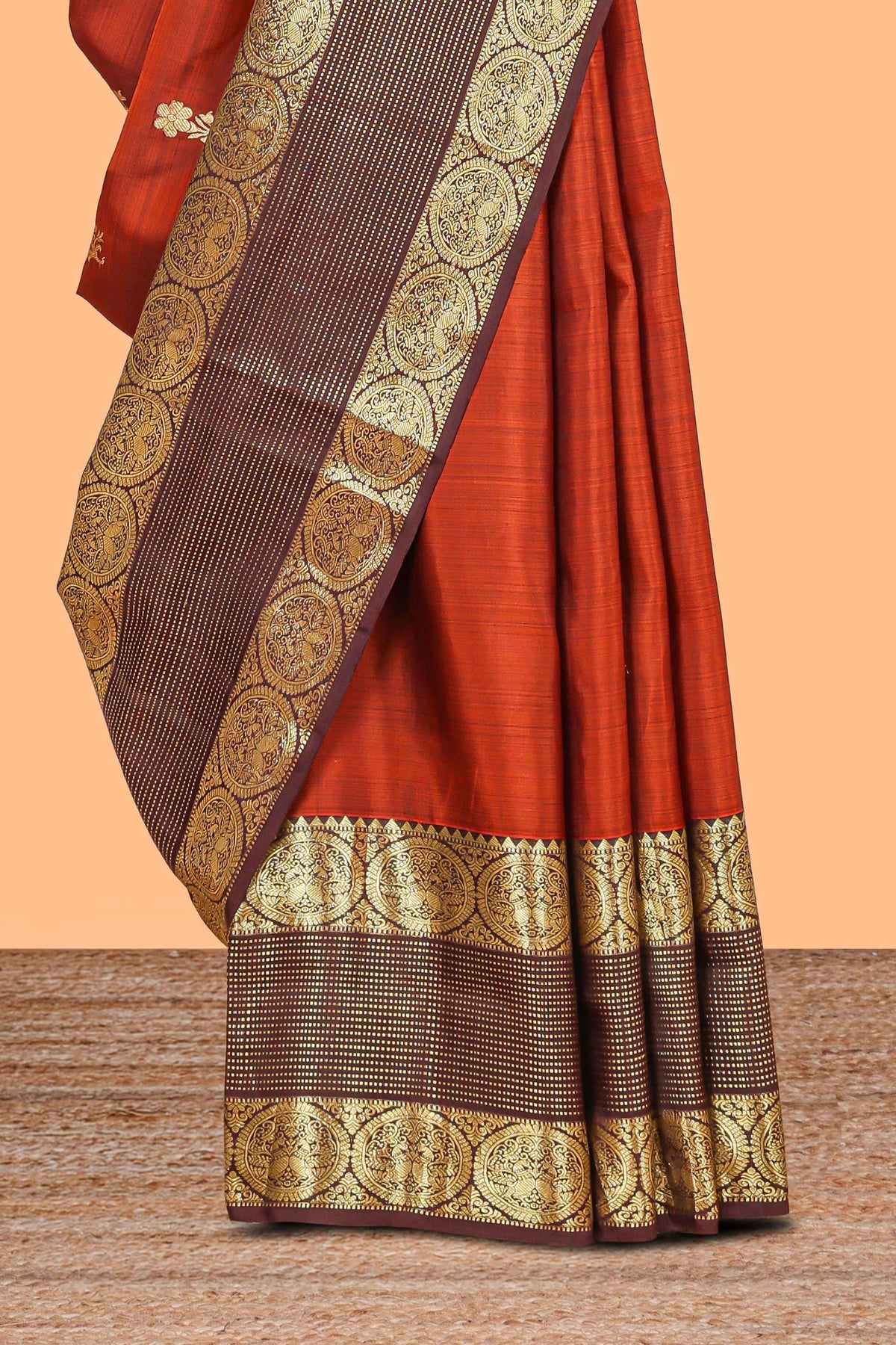 Rust orange butta designed parambariya pattu saree with contrast retta patta zari border and geometric zari designed pallu