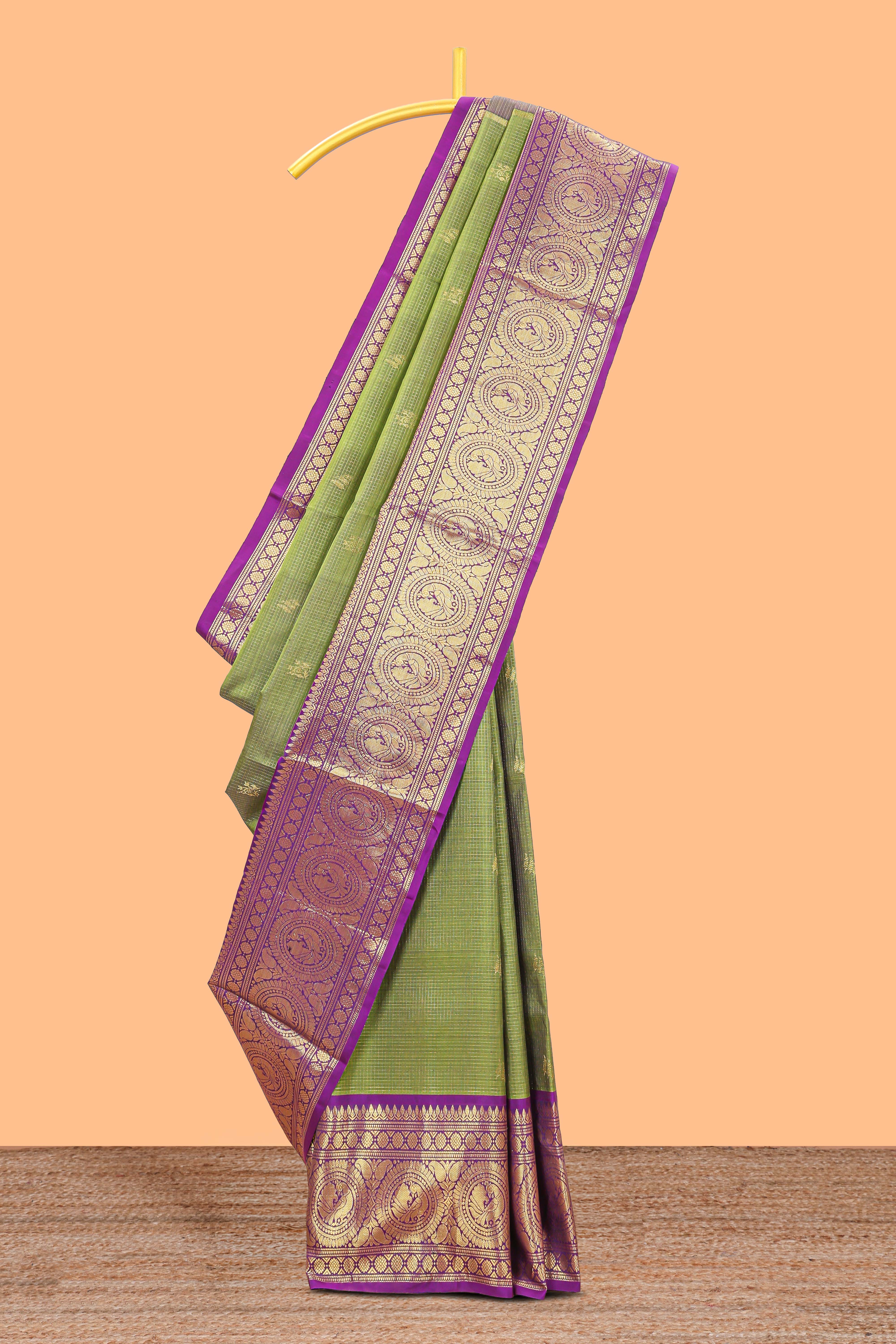Olive green checked with floral motifs parambariya pattu saree with circular zari medallion border with striped zari designed pallu