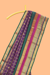 Purple color zari checked parambariya pattu saree with deep green border with zari stripes and contrast checked pallu with blouse