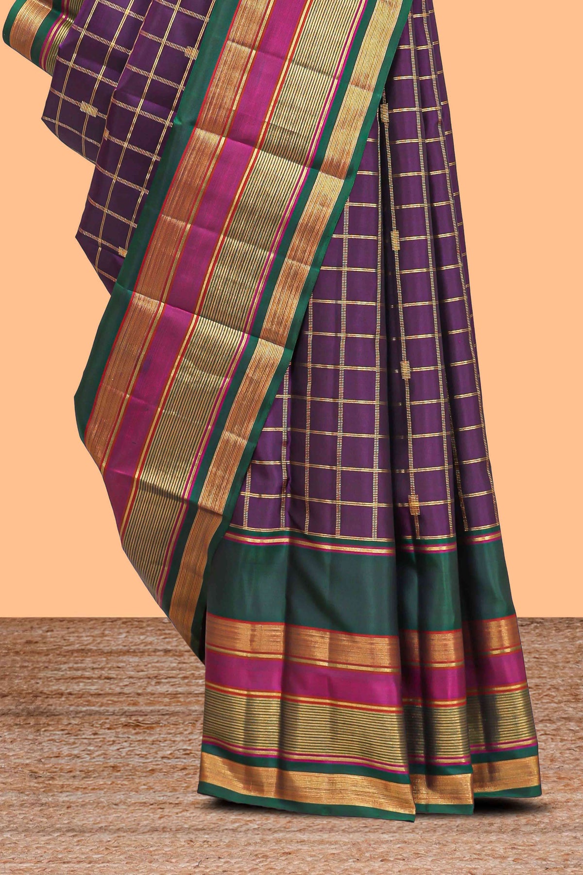 Purple color zari checked parambariya pattu saree with deep green border with zari stripes and contrast checked pallu with blouse