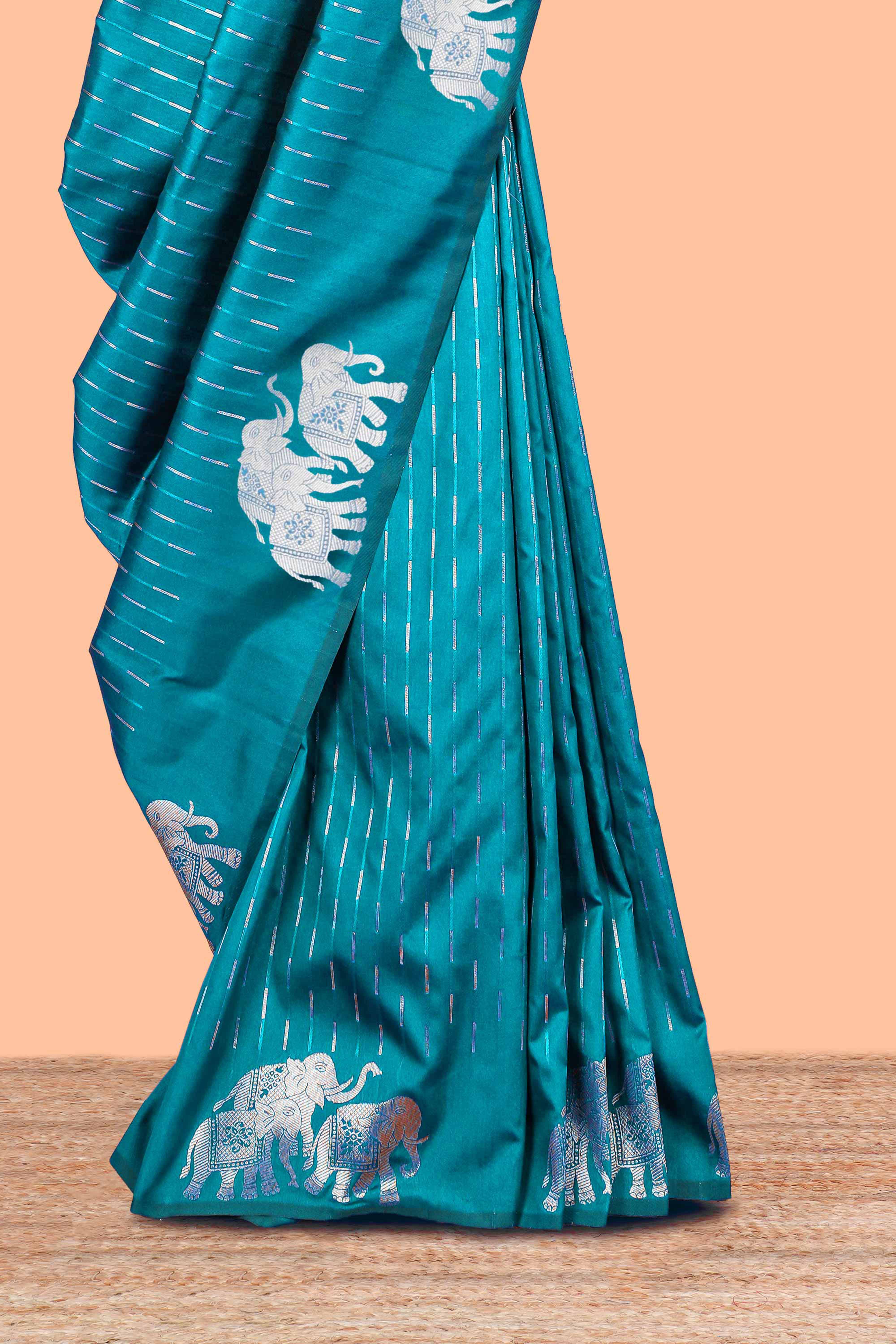 Peacock green semi soft silk woven saree