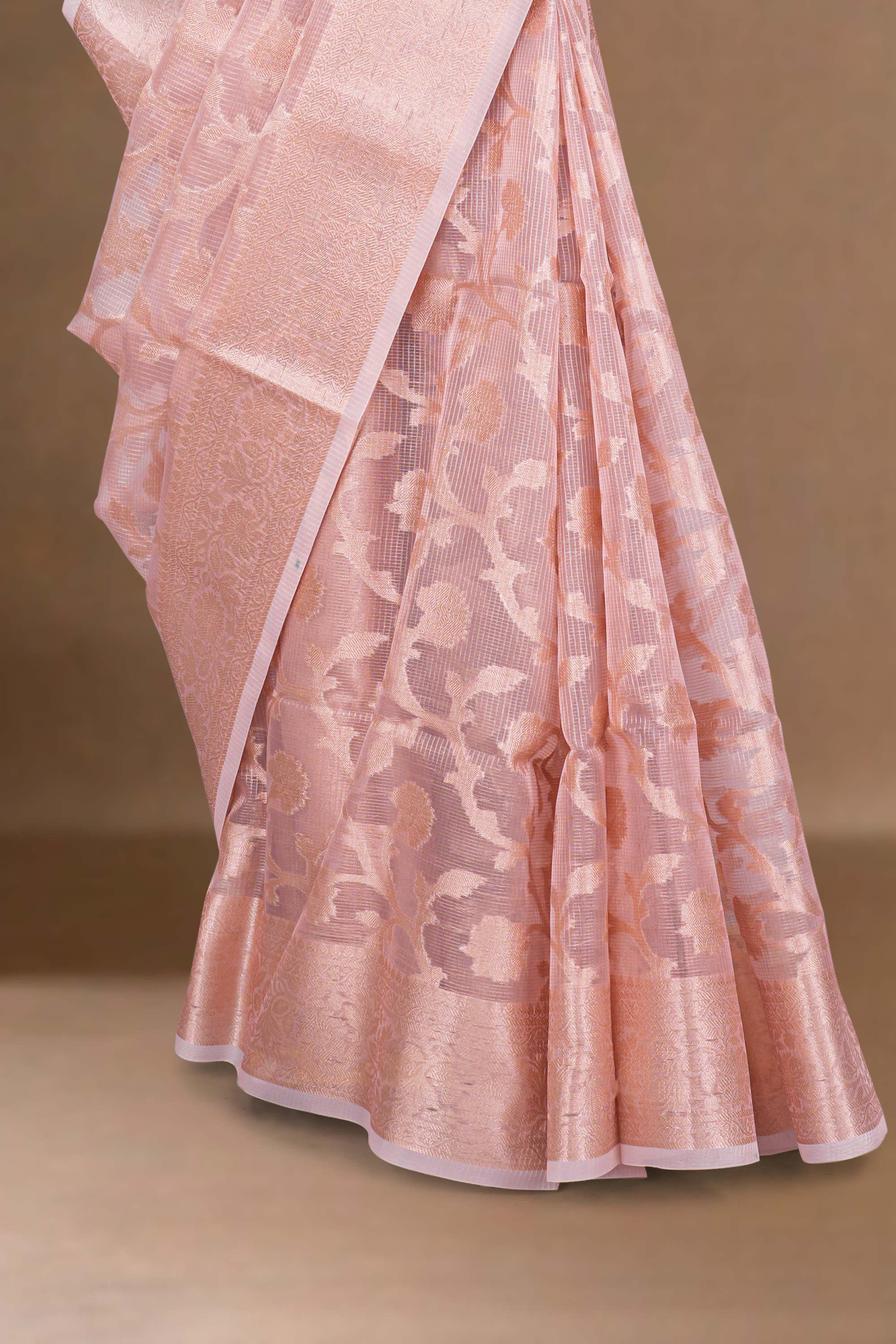 Pink saree with intricate patterns