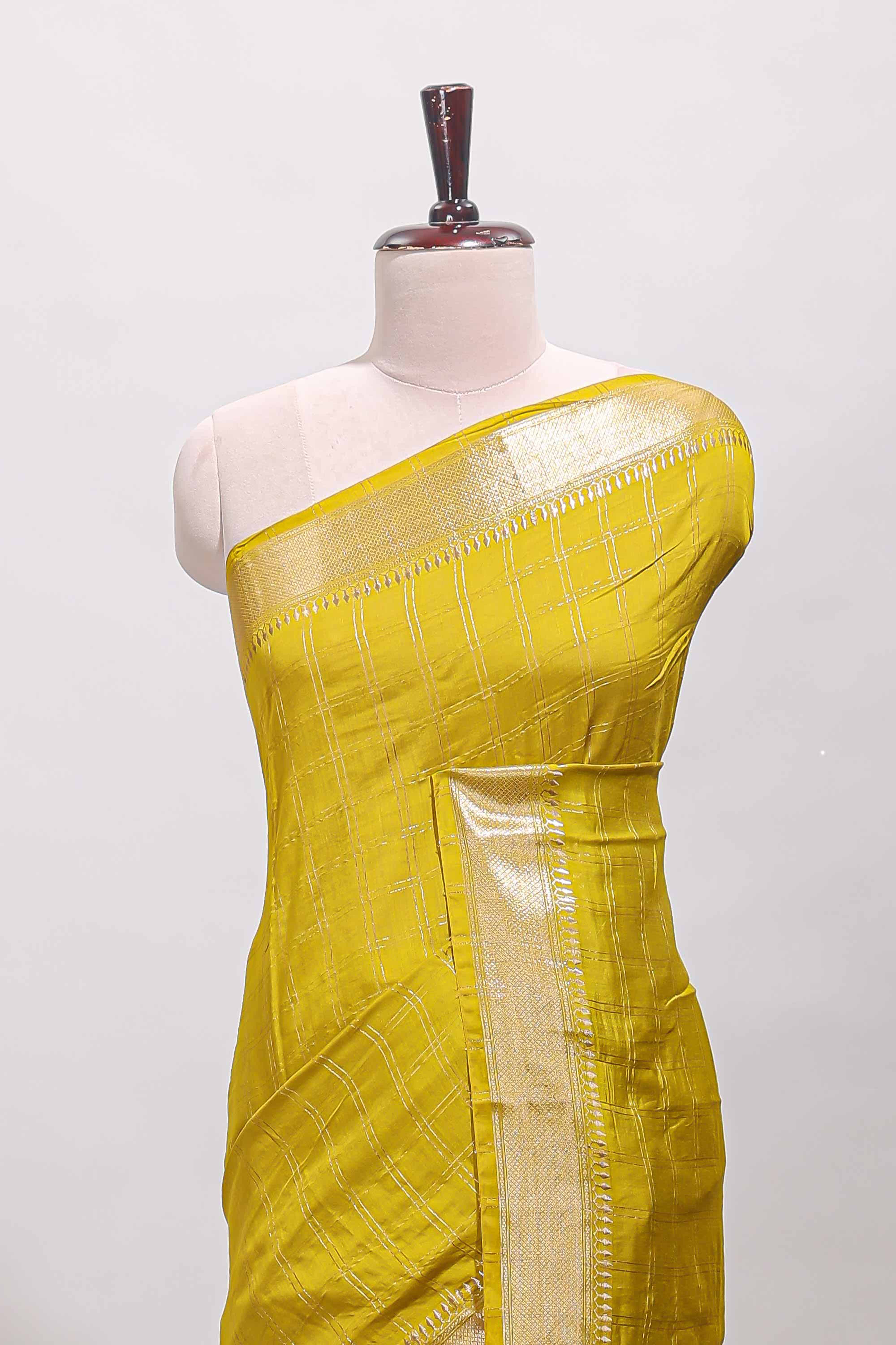 Lemon yellow checked semi banaras chiffon saree with self zari border and contrast blouse
