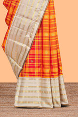 Yellow checked and butta designed swayamvara pattu saree with contrast border with zari stripes and pallu comes with cream color plain blouse
