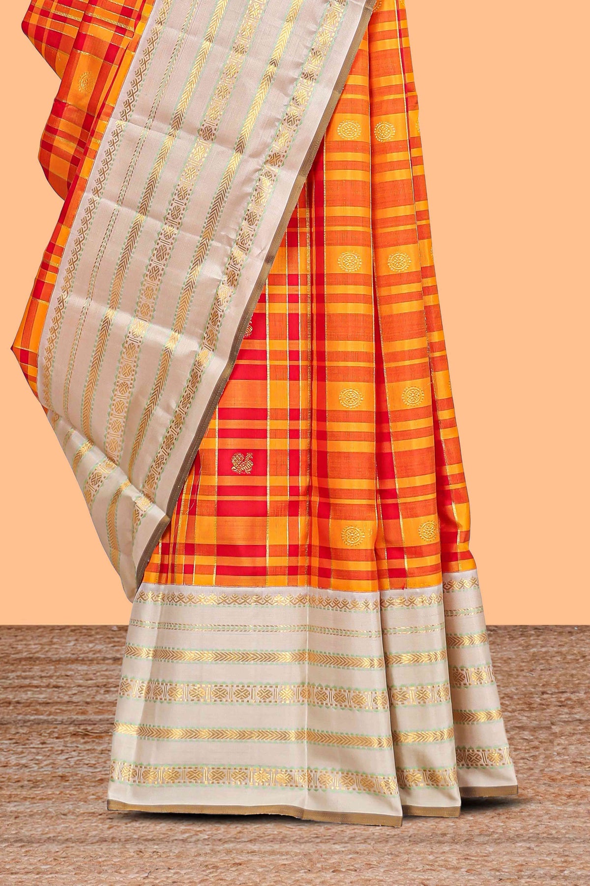 Yellow checked and butta designed swayamvara pattu saree with contrast border with zari stripes and pallu comes with cream color plain blouse
