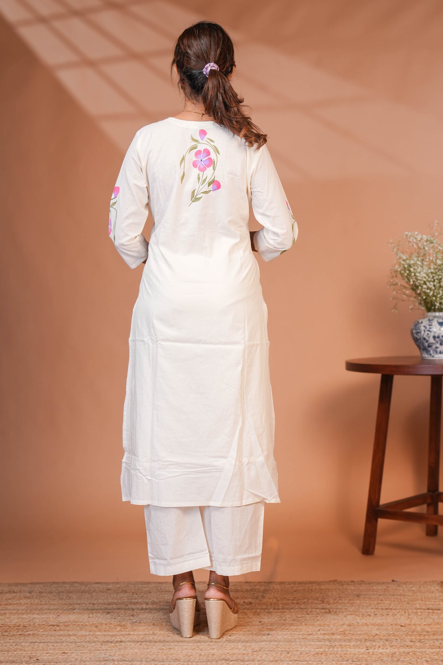 White floral design v neck salwar set with 3/4th sleeve, self bottom and matching dupatta
