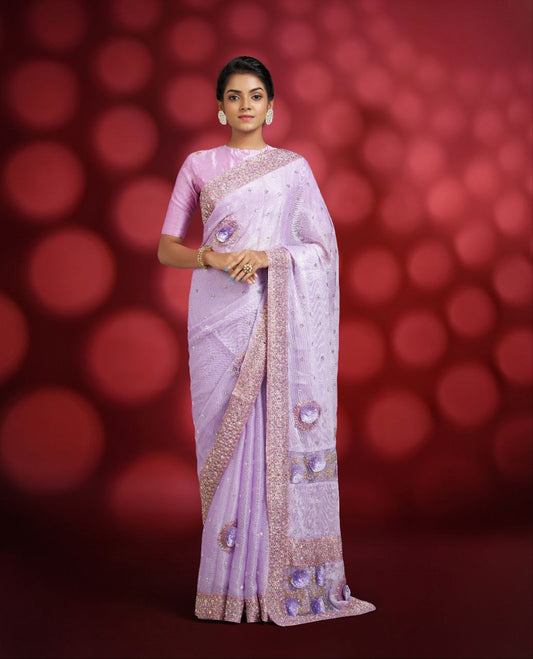 A lavender-colored fancy designer saree
