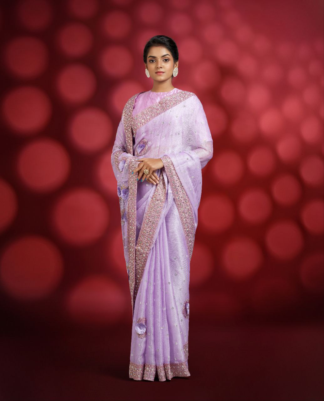 A lavender-colored fancy designer saree
