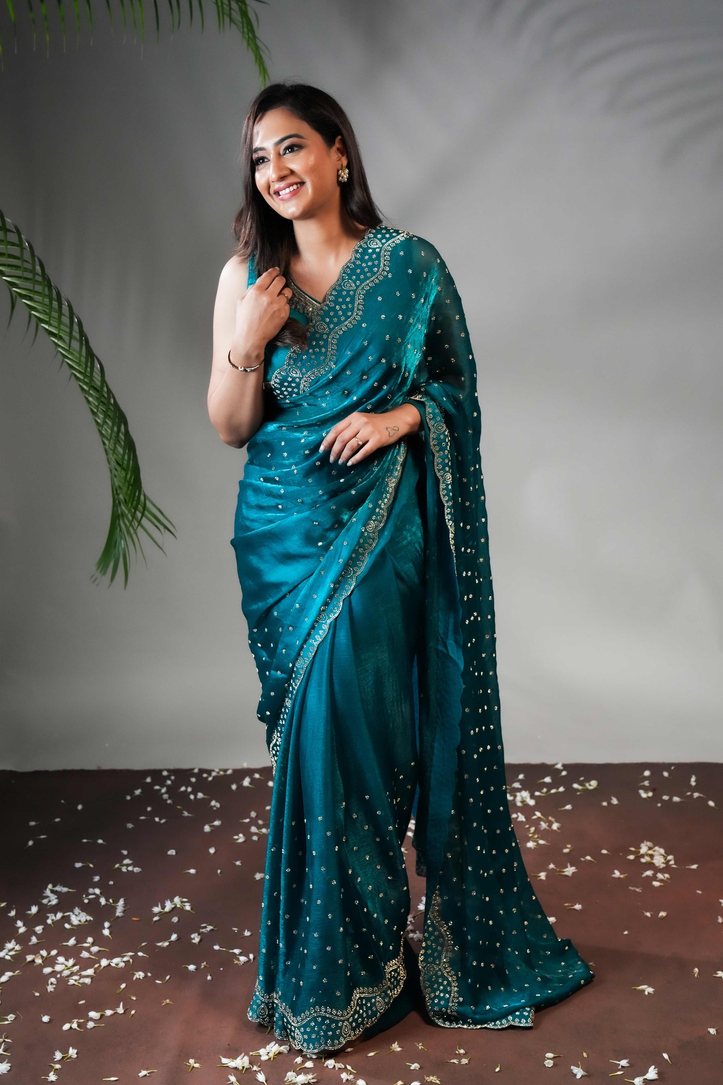 Green Stone work all over body designer saree with scallop design border matching blouse